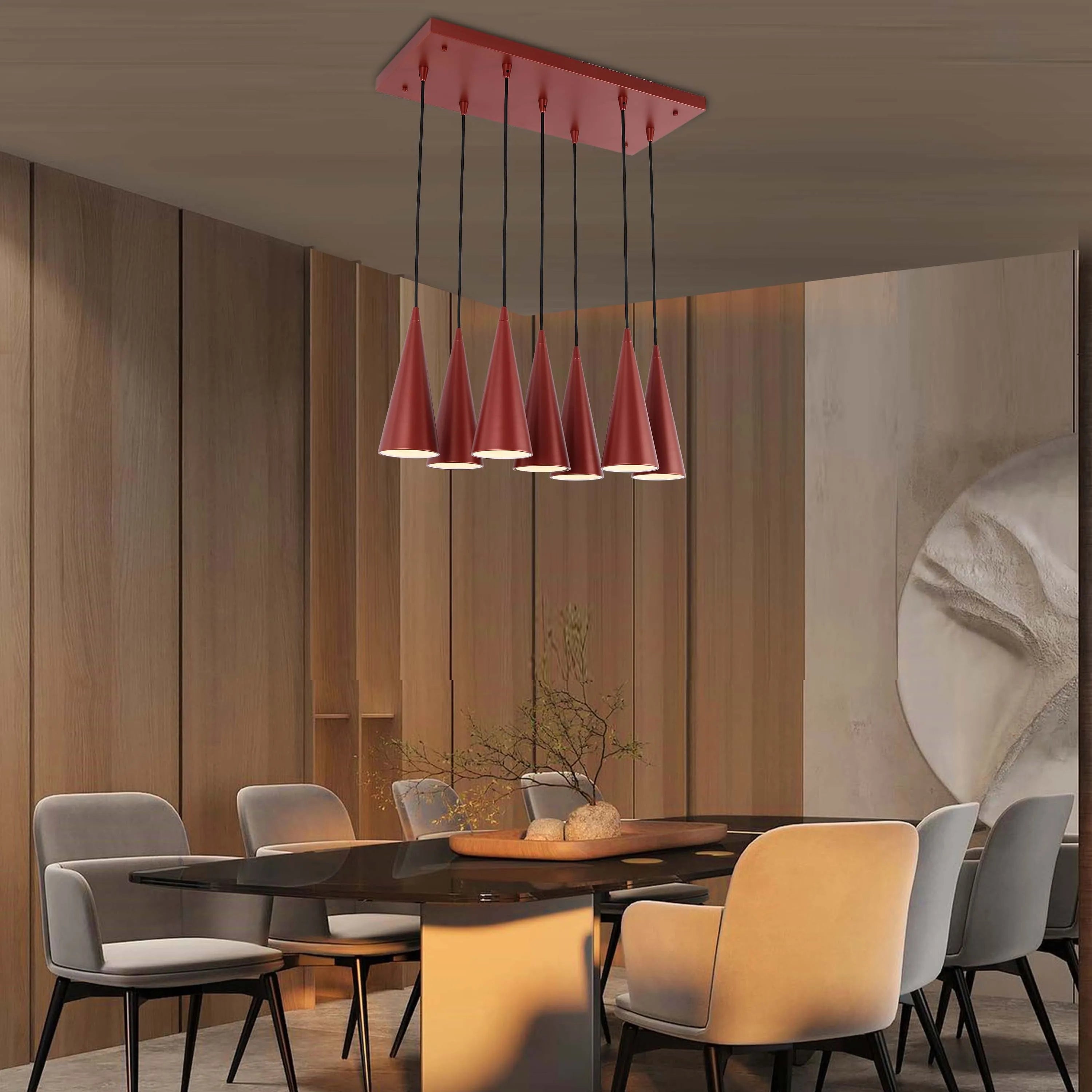 A modern dining room features a sleek, dark glass table lit by a stylish, red pendant light with seven cone-shaped shades.