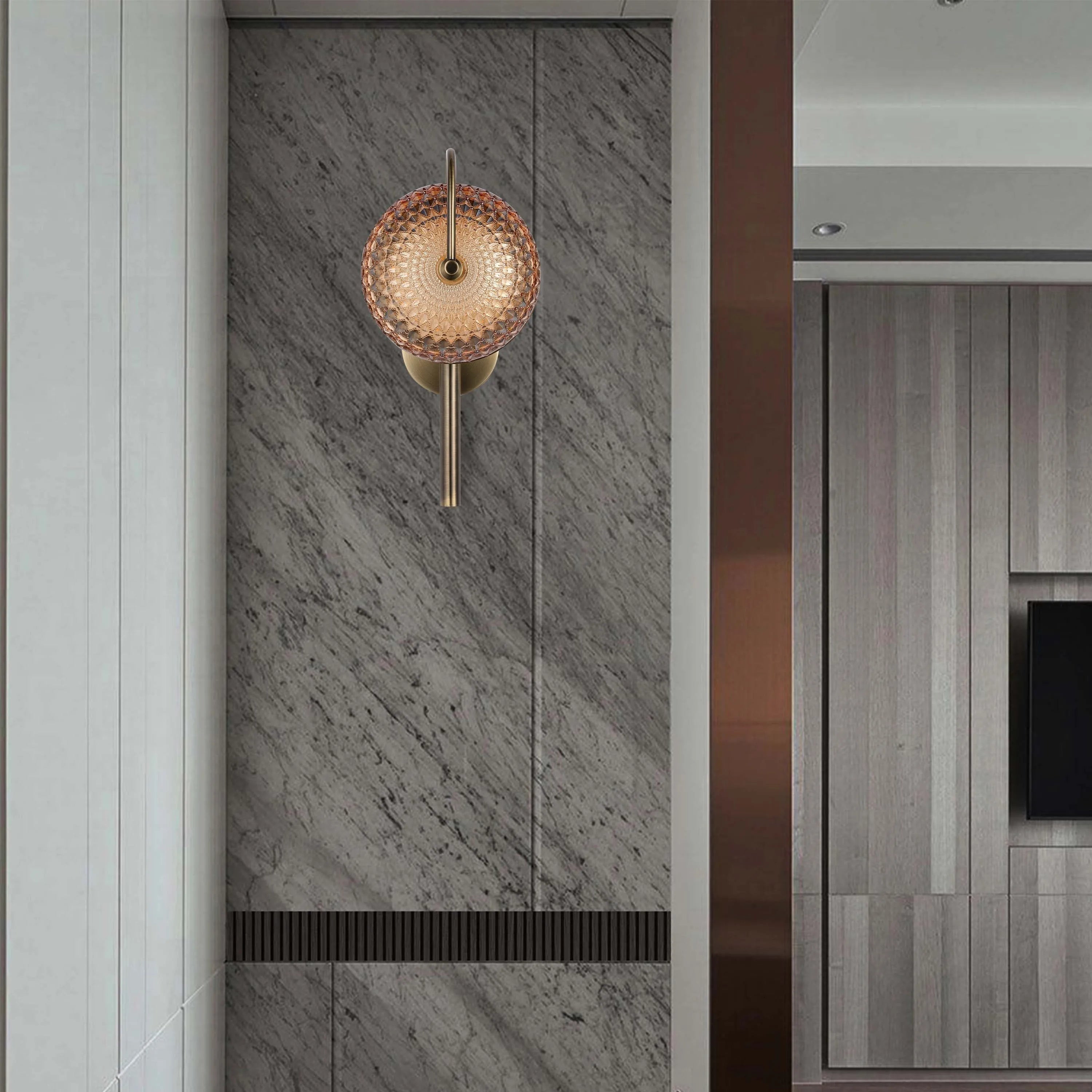 A decorative wall light fixture with a circular, patterned shade and a brass-tone finish adds warmth to a contemporary interior.