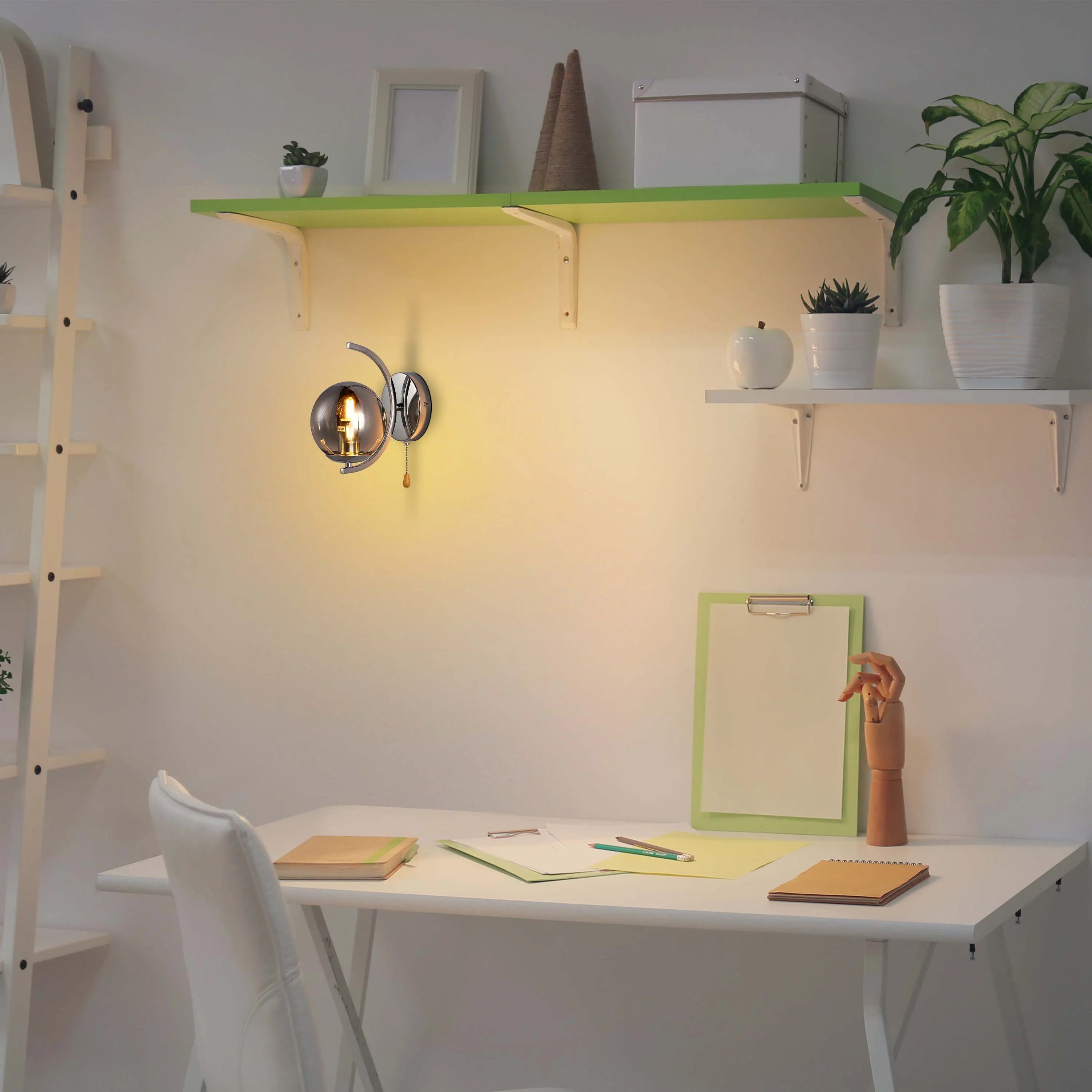 A warm, glowing wall light fixture illuminates a minimalist workspace with white furniture and vibrant green shelves.