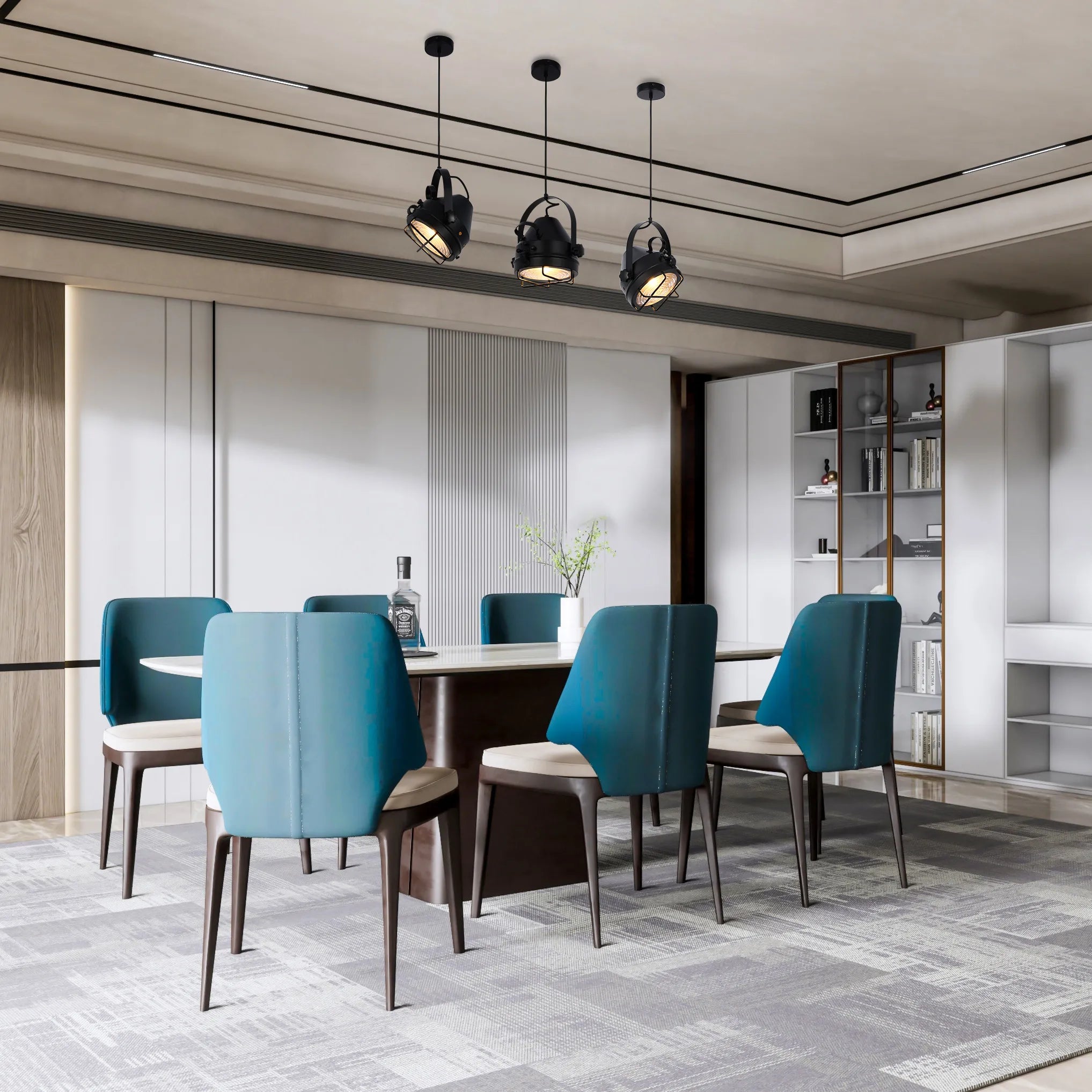 Three industrial style pendant lights hang above a dining table, providing directional downlighting in a modern dining space.