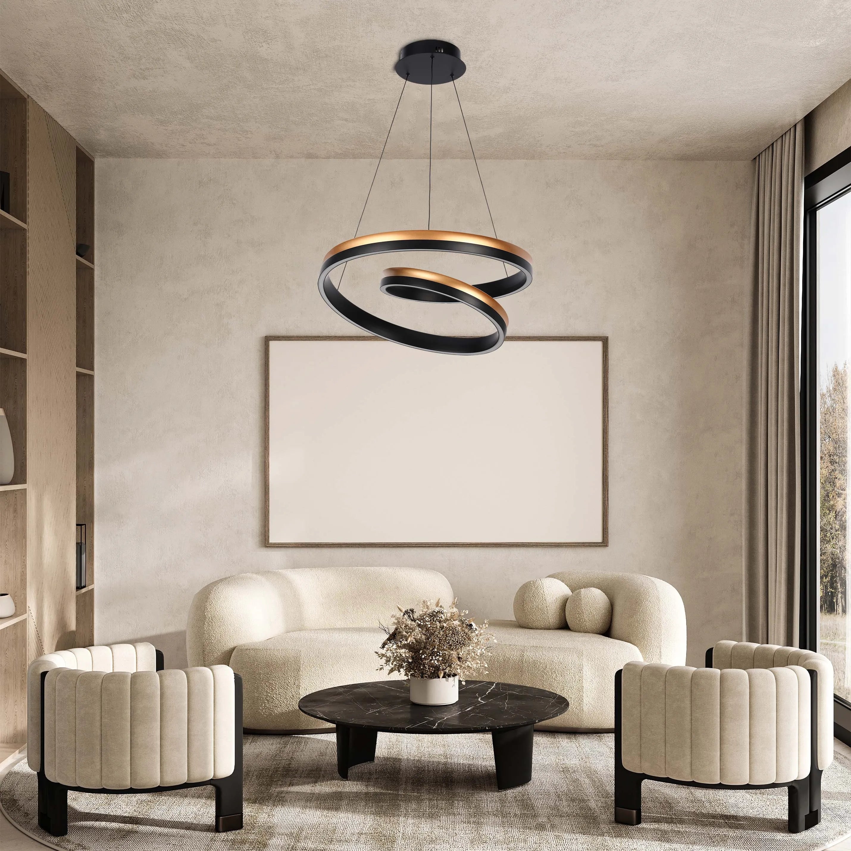 A modern ringed light fitting hangs over a cream lounge set in an elegant living room. The light is black and gold.