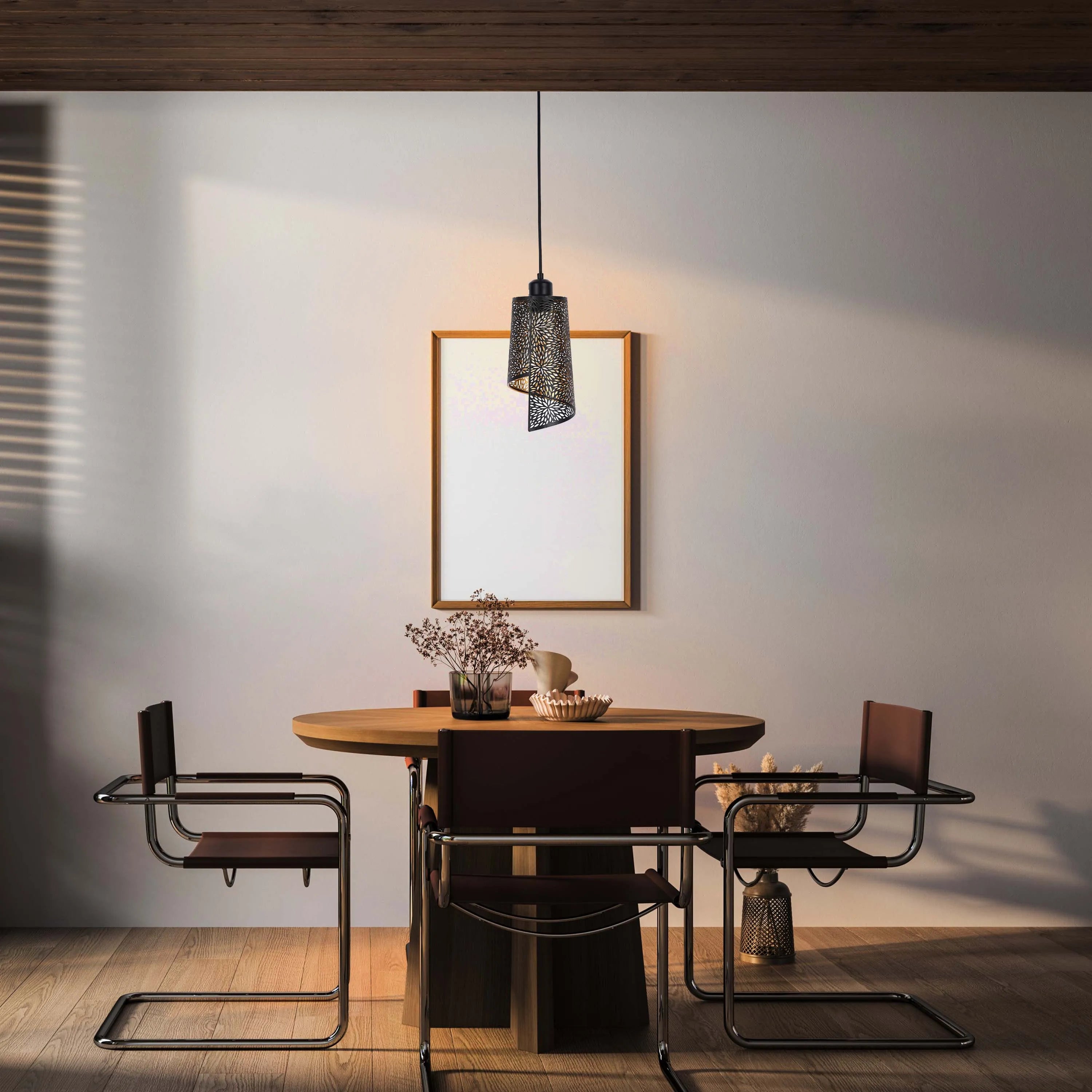 A pendant light illuminates a dining space, casting a warm glow. Natural light filters in, creating a mix of shadows and highlights.