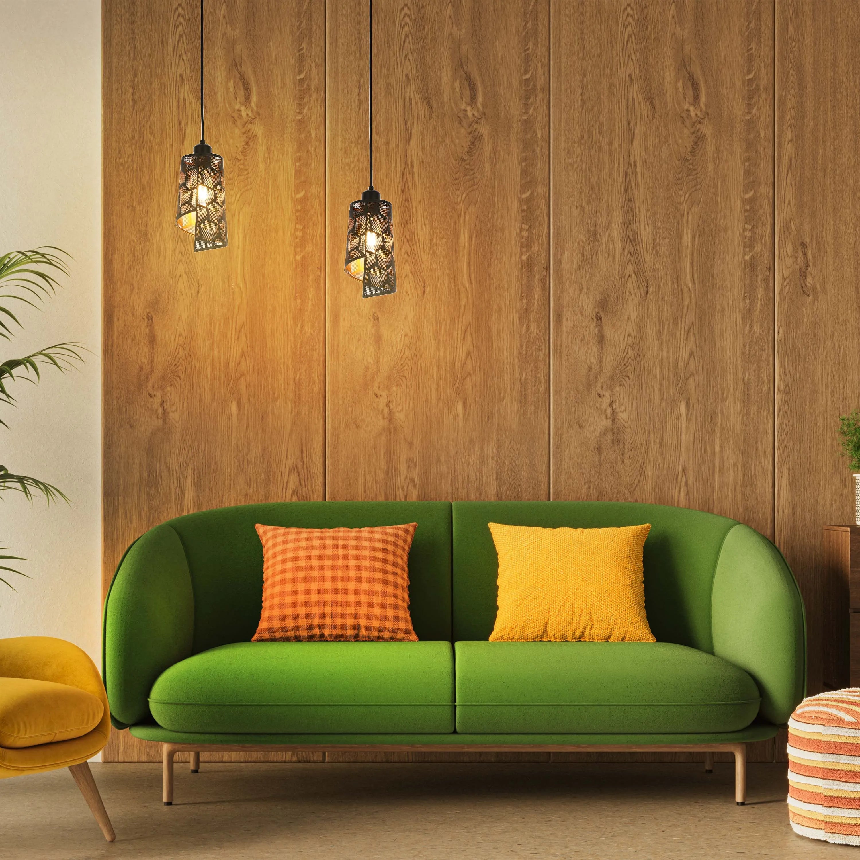 Pendant lights hang above a green sofa. Warm ambient lighting enhances the wood panelled wall and the textured yellow and orange cushions.