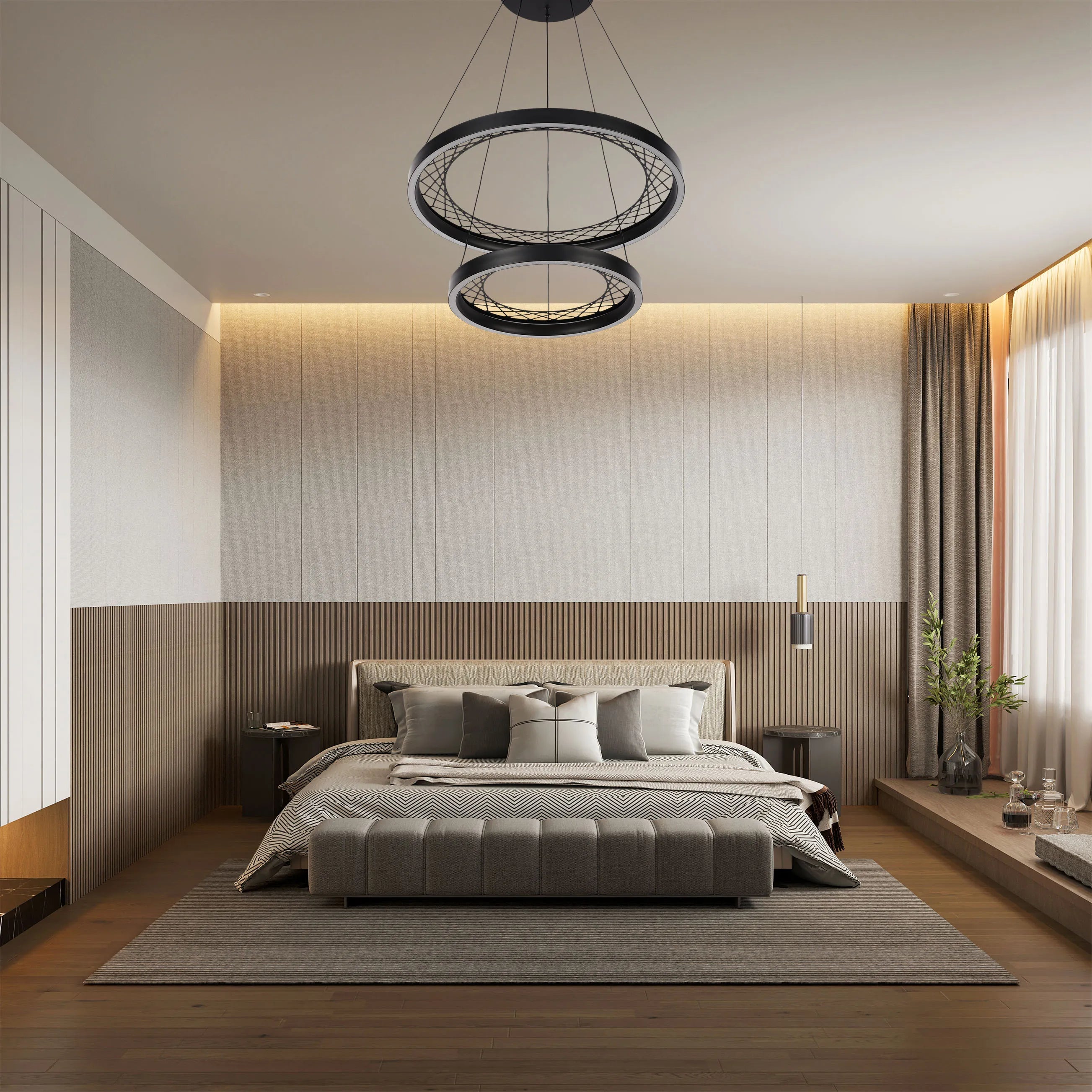 A modern bedroom featuring a statement black circular pendant light, casting a soft glow over the neutral-toned room.