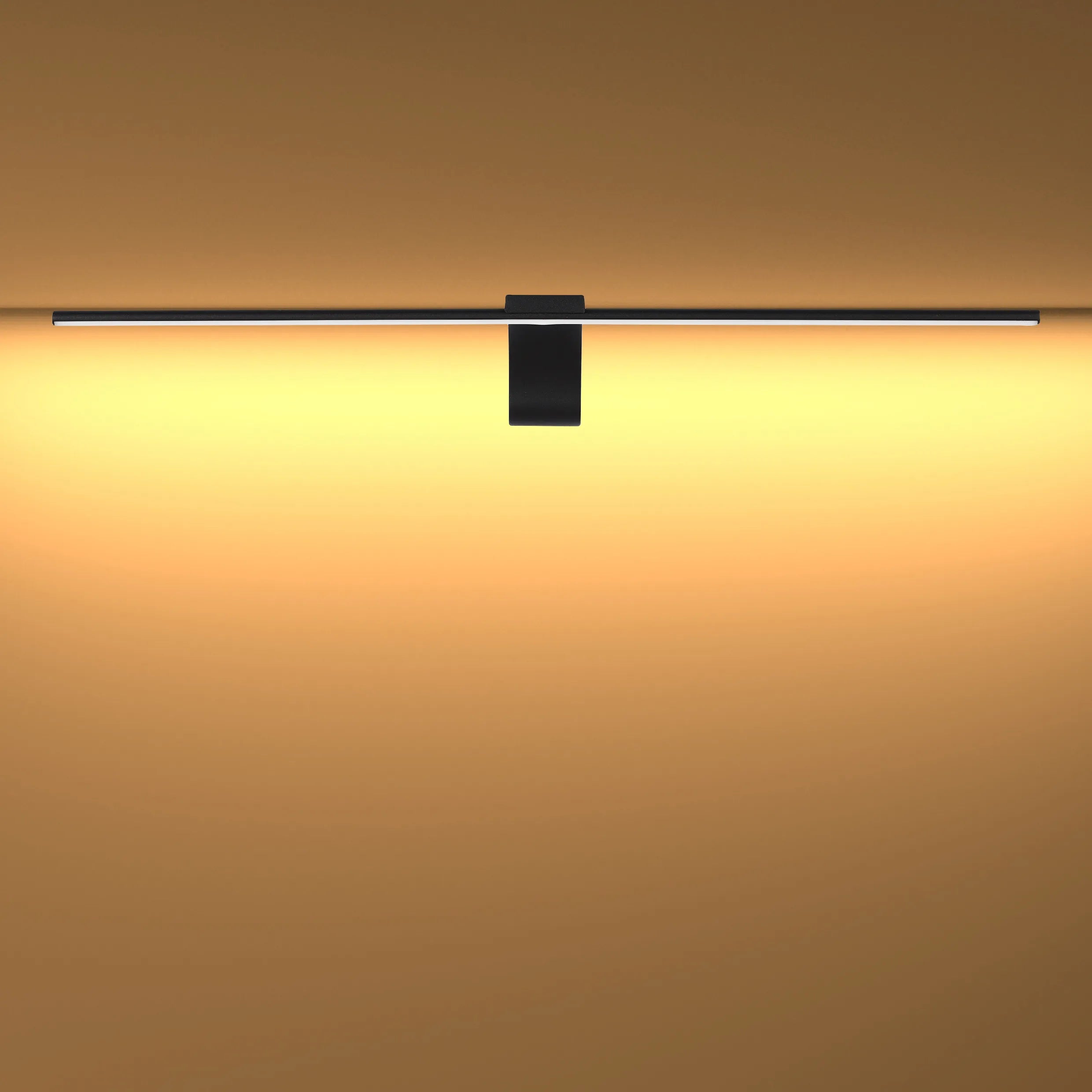 Modern wall light in black, emitting a soft warm glow. Stylish and energy-efficient lighting solution for any room.