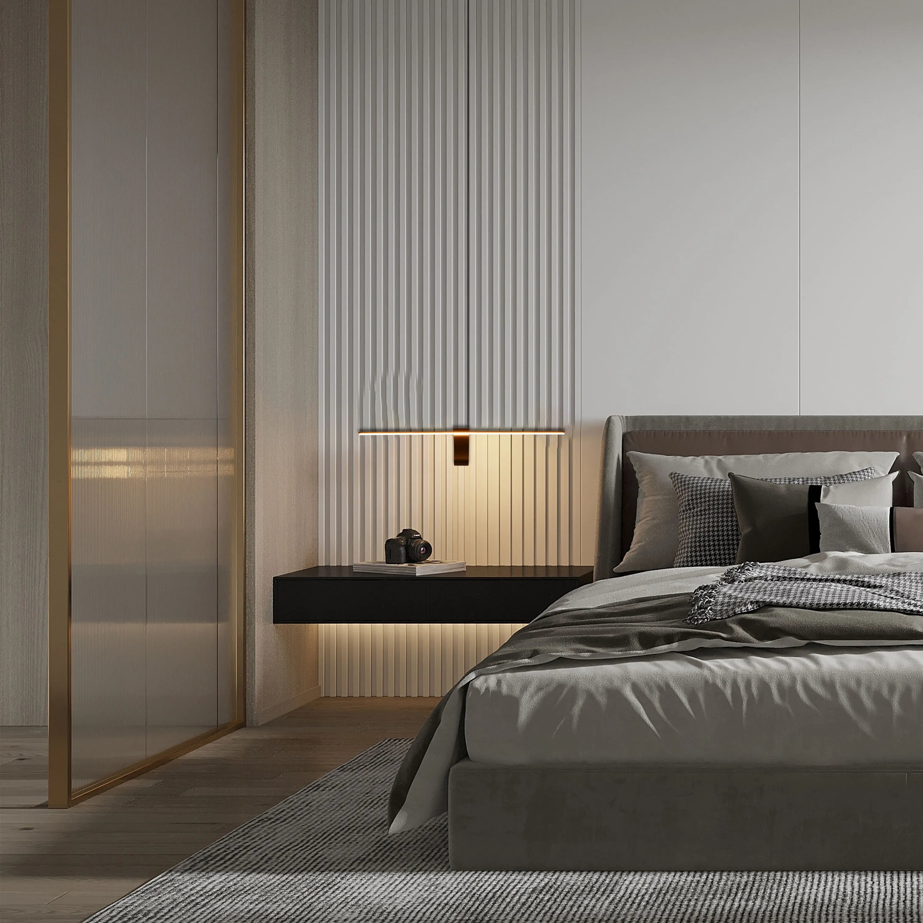 Understated and modern bedroom lighting: A strip light and recessed lights create soft, ambient illumination.
