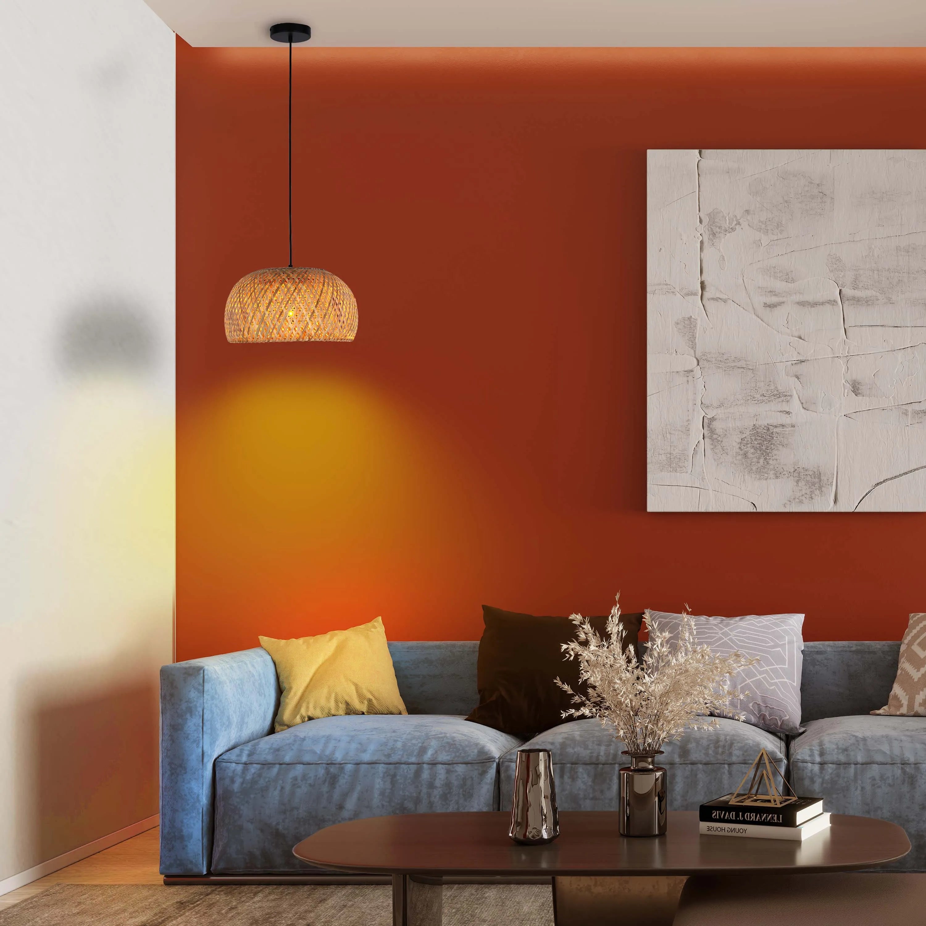 Cosy, warm lighting from a woven pendant lamp creates an inviting ambience in this stylish living room setup.