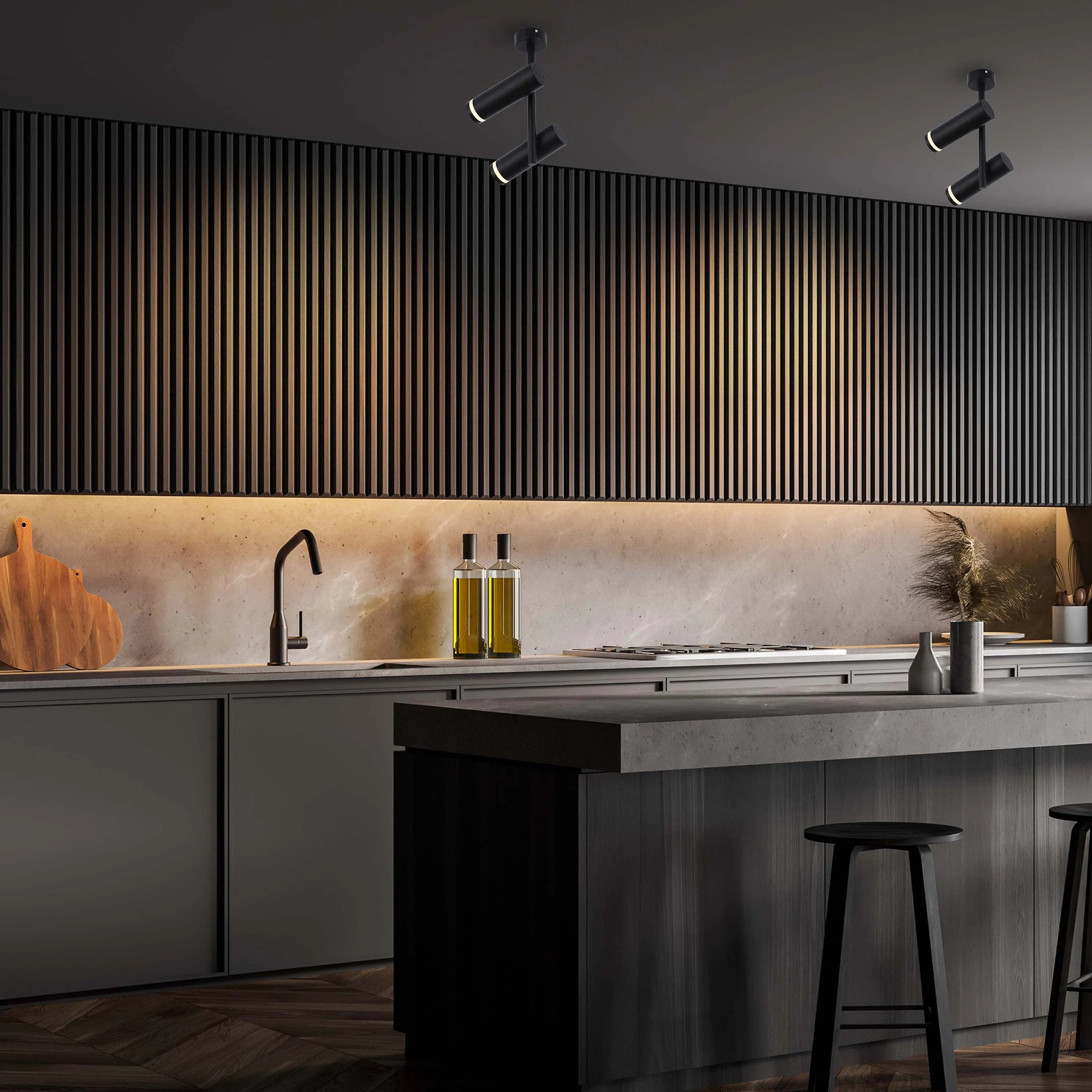 Modern black spotlights illuminate this contemporary kitchen. The fixtures have a sleek, minimalist design.