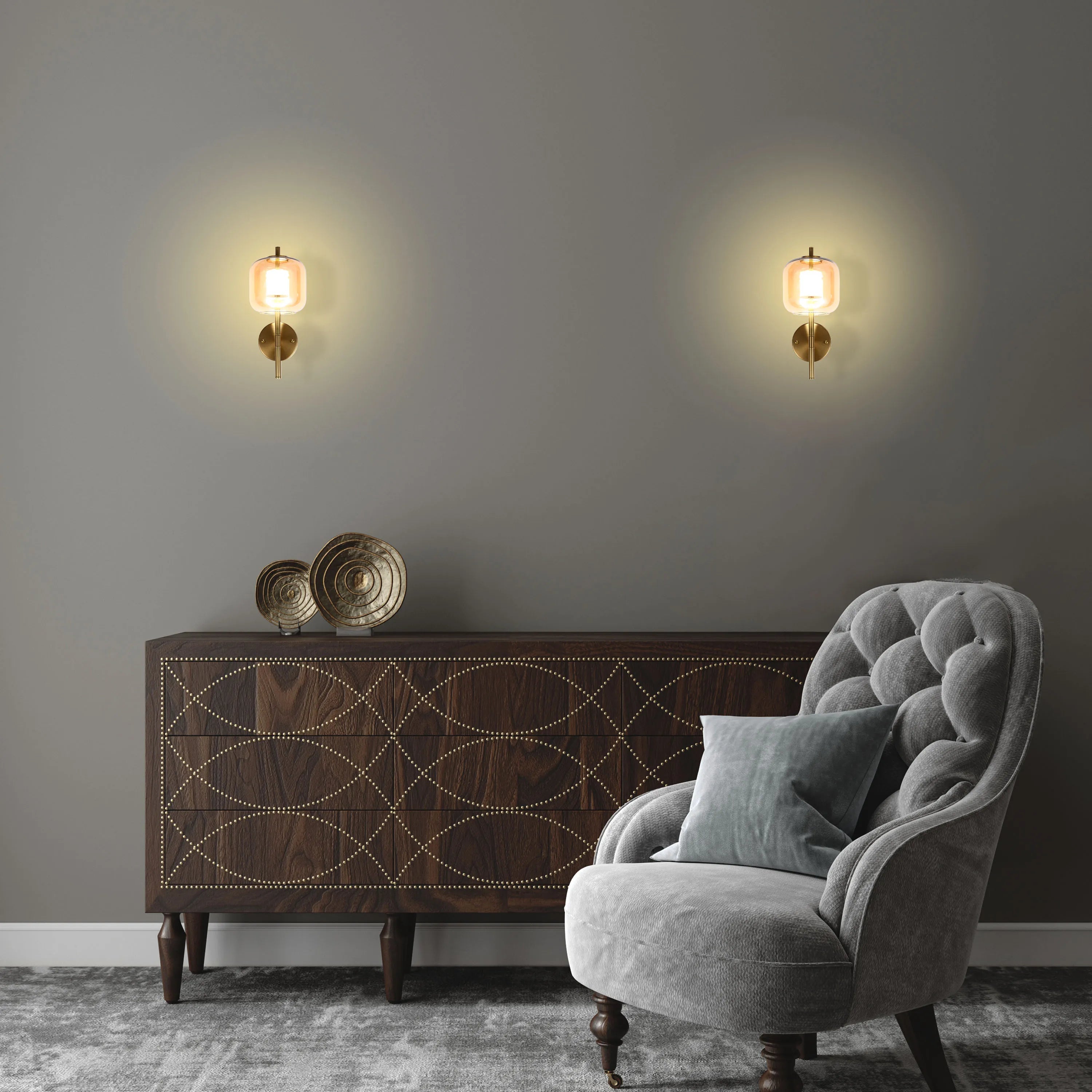 Wall lights with a warm glow illuminate a room with a rustic wooden cabinet and grey armchair.