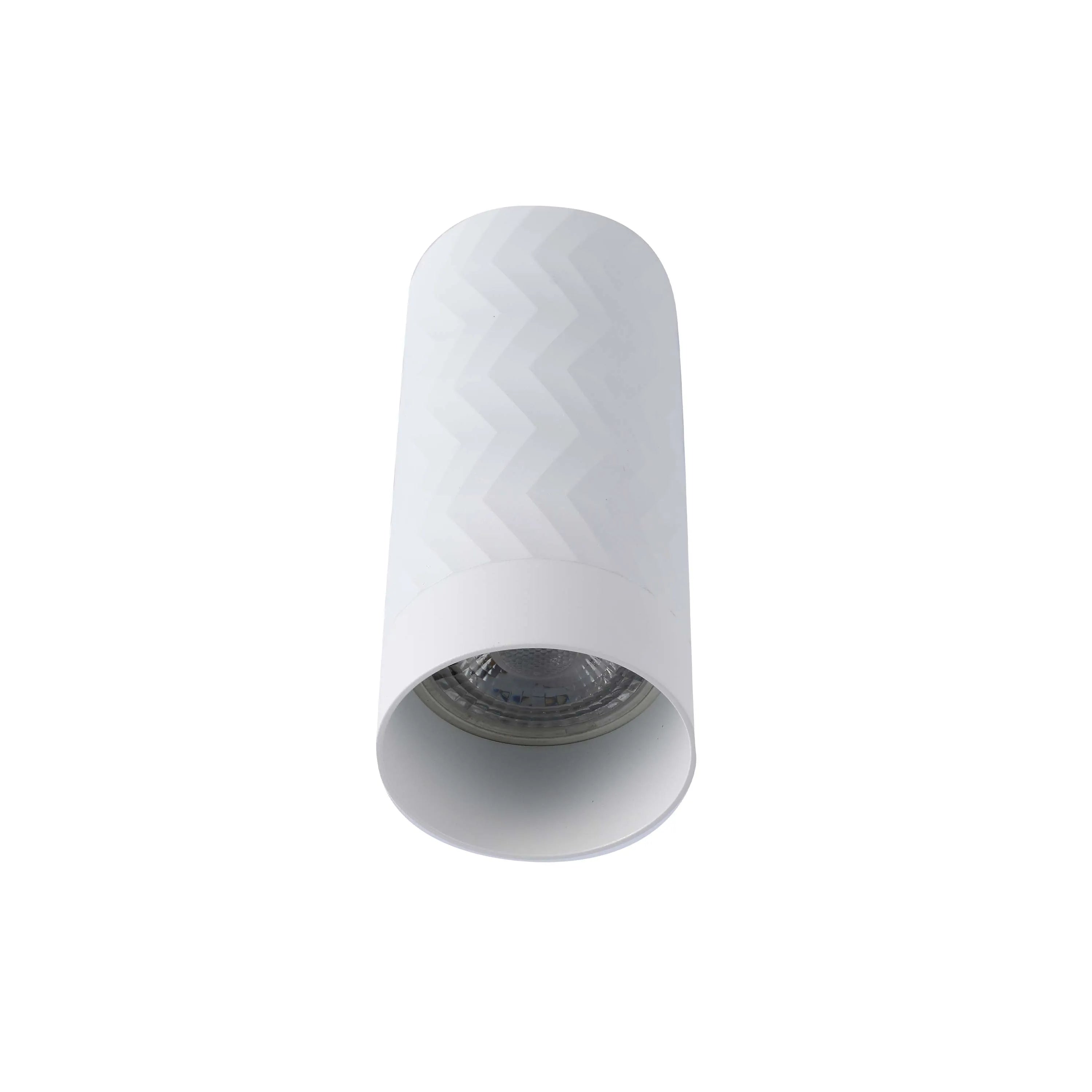 A white, cylindrical downlight with a subtle chevron pattern. Contemporary and minimalist, ideal for modern interiors.