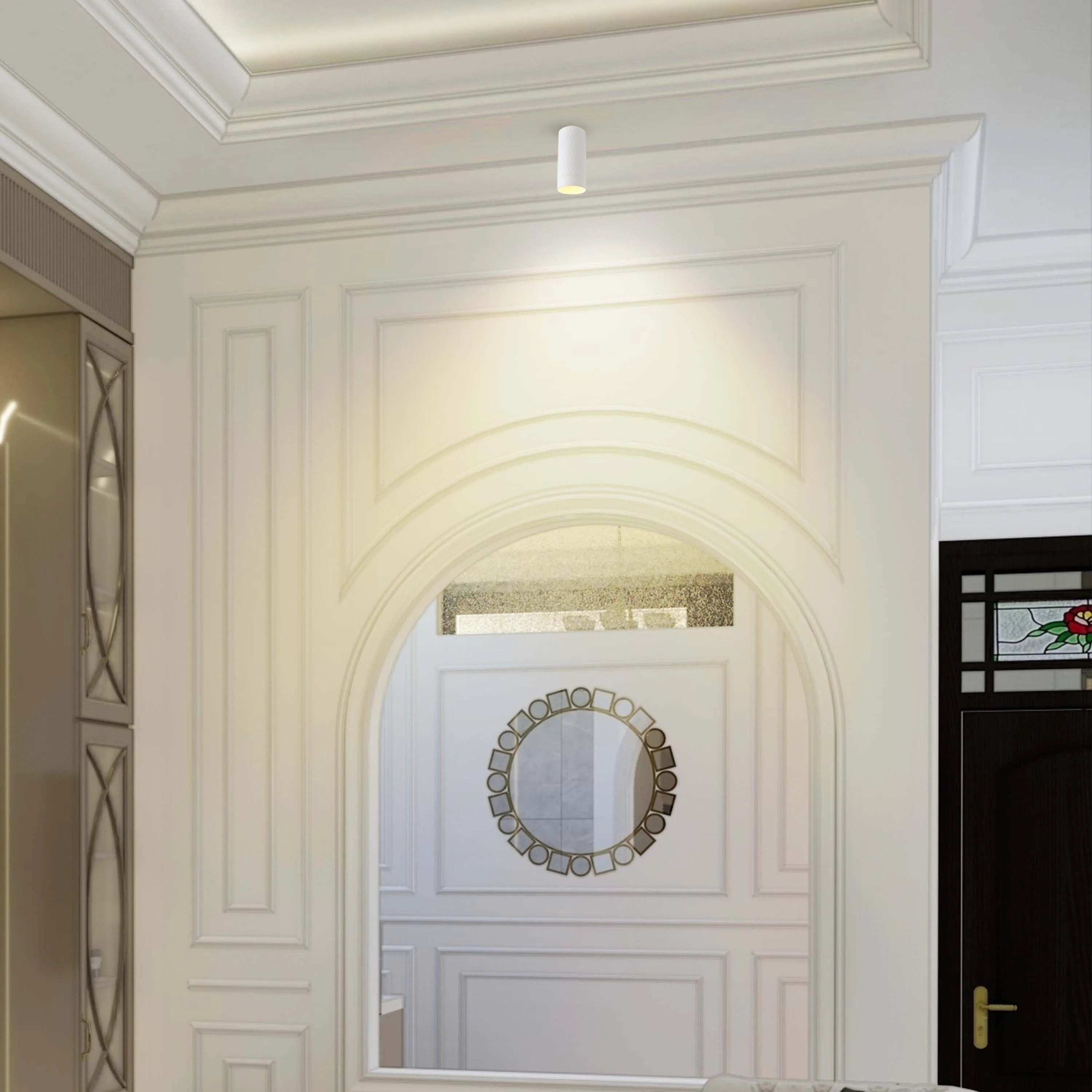 Recessed downlight providing focused illumination. Adds a subtle architectural touch to the elegant, ornate space.