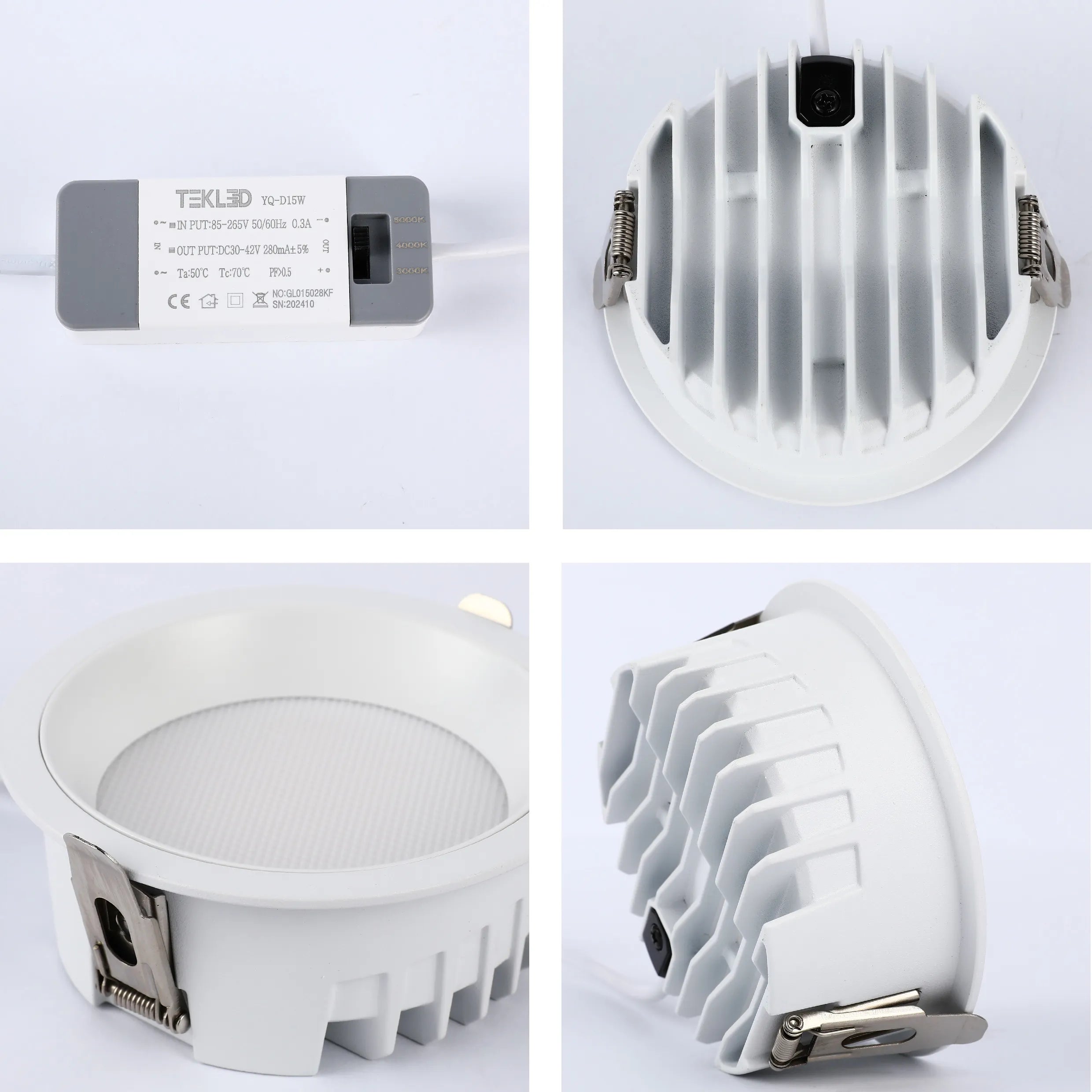 A recessed LED downlight with a white finish, showing the driver, heat sink, and spring clips.