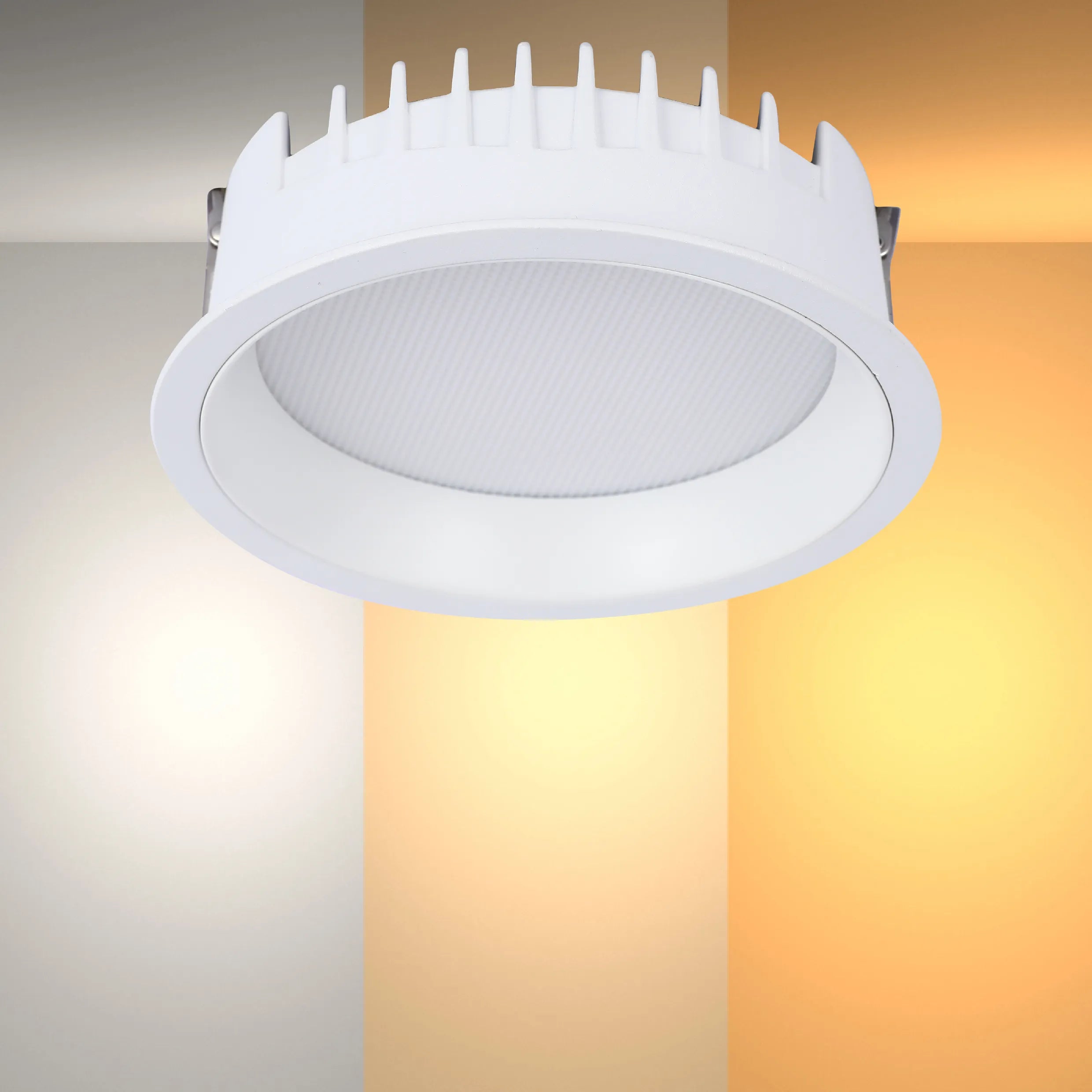 A white, round LED downlight with a ridged heat sink, set against a colour gradient showcasing different colour temperatures.