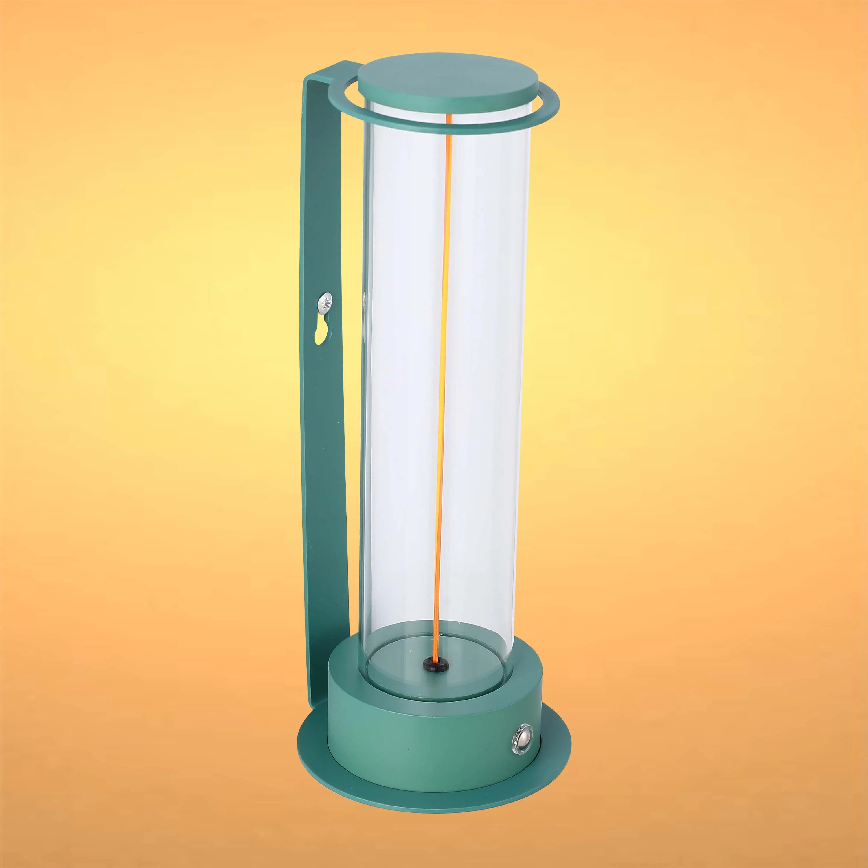 Green modern lamp with a clear glass tube and warm light inside. Stylish, minimalist design.