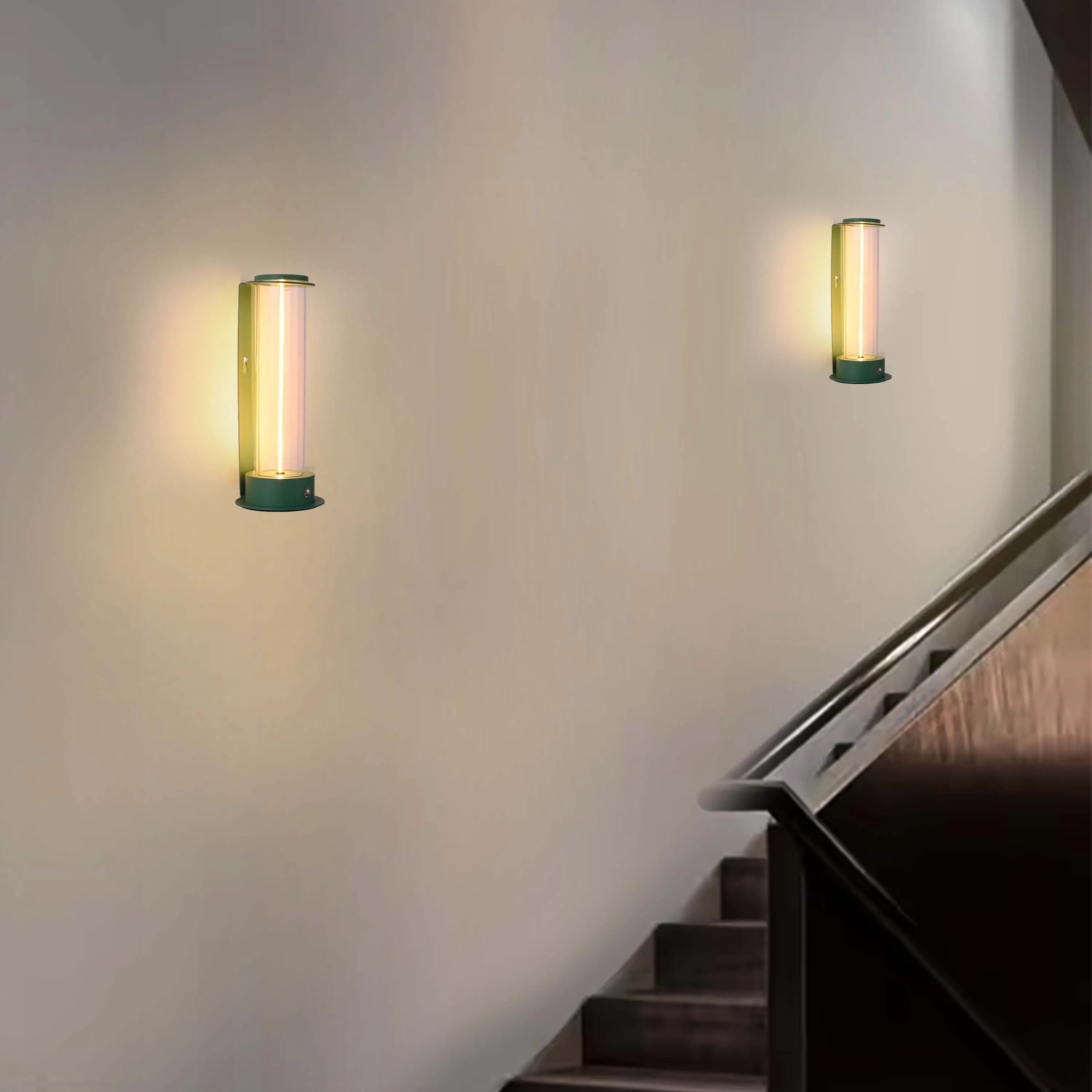 Stylish wall-mounted sconces illuminate a neutral stairwell, creating a warm and inviting atmosphere with their soft, ambient glow.