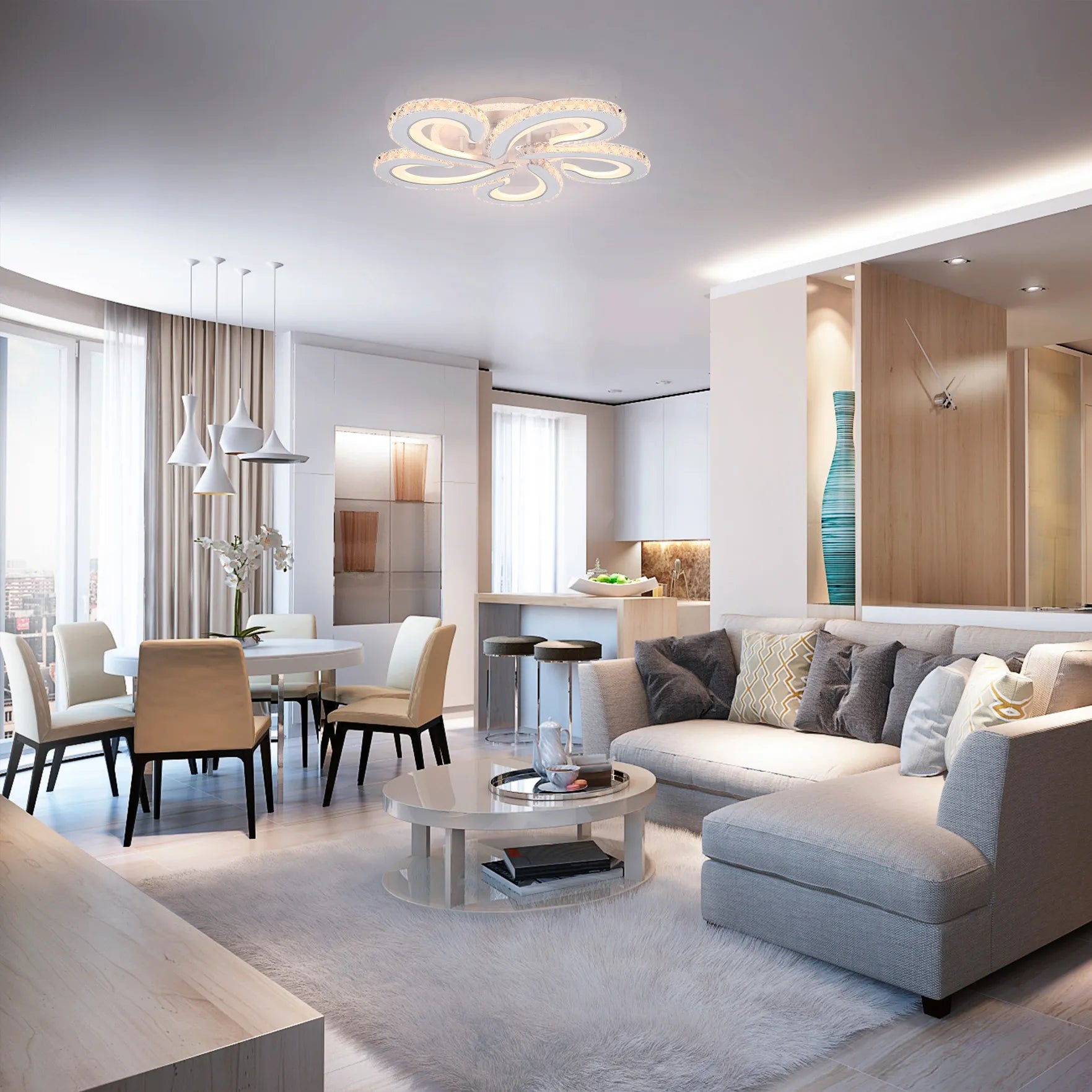 Modern living room with decorative flower ceiling light, dining pendants, and recessed accent lights.