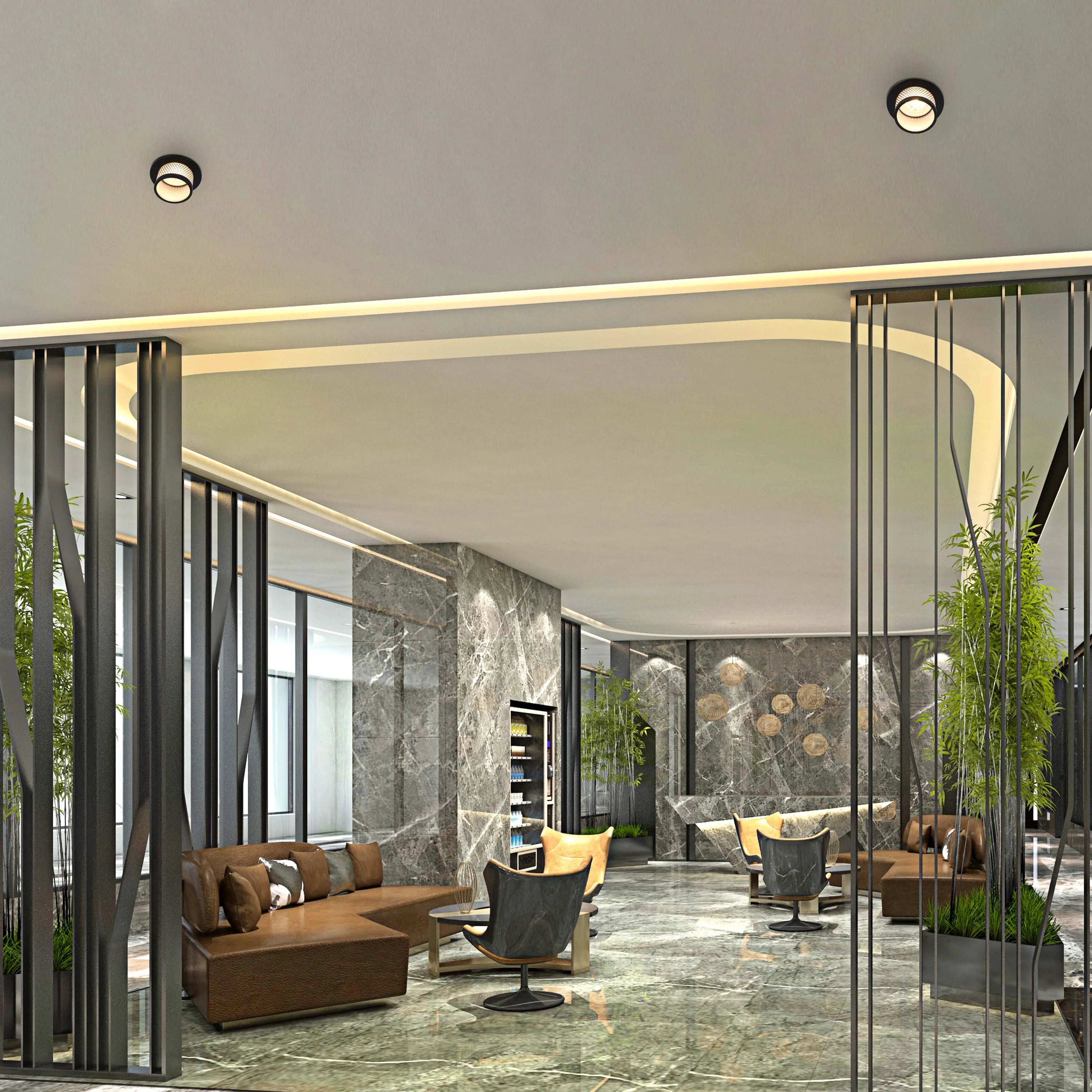 A modern lobby with circular ceiling lights. The space features elegant, recessed lighting around a curved architectural feature.