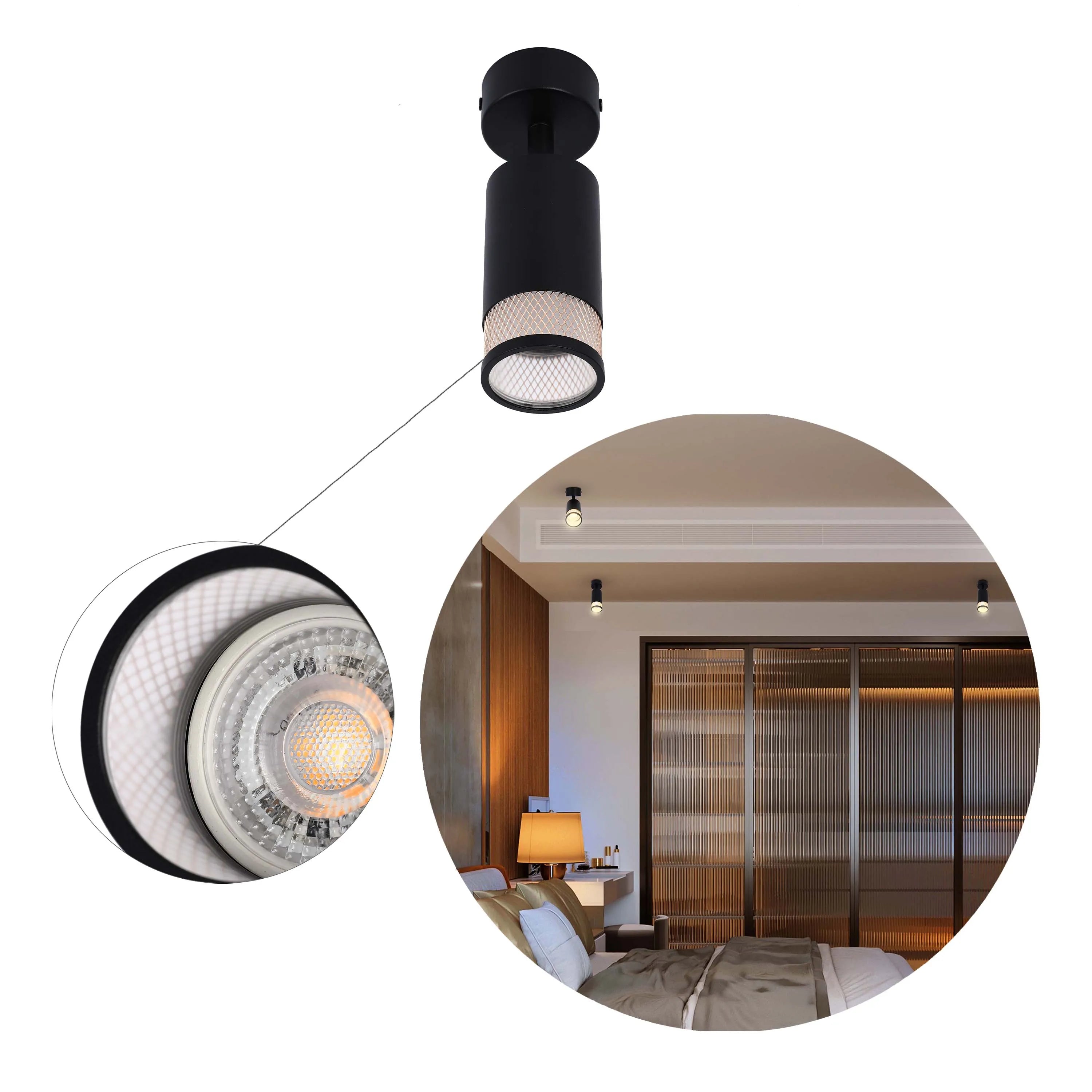 A black ceiling spotlight illuminates a modern bedroom with warm lighting from additional spotlights and a bedside lamp.