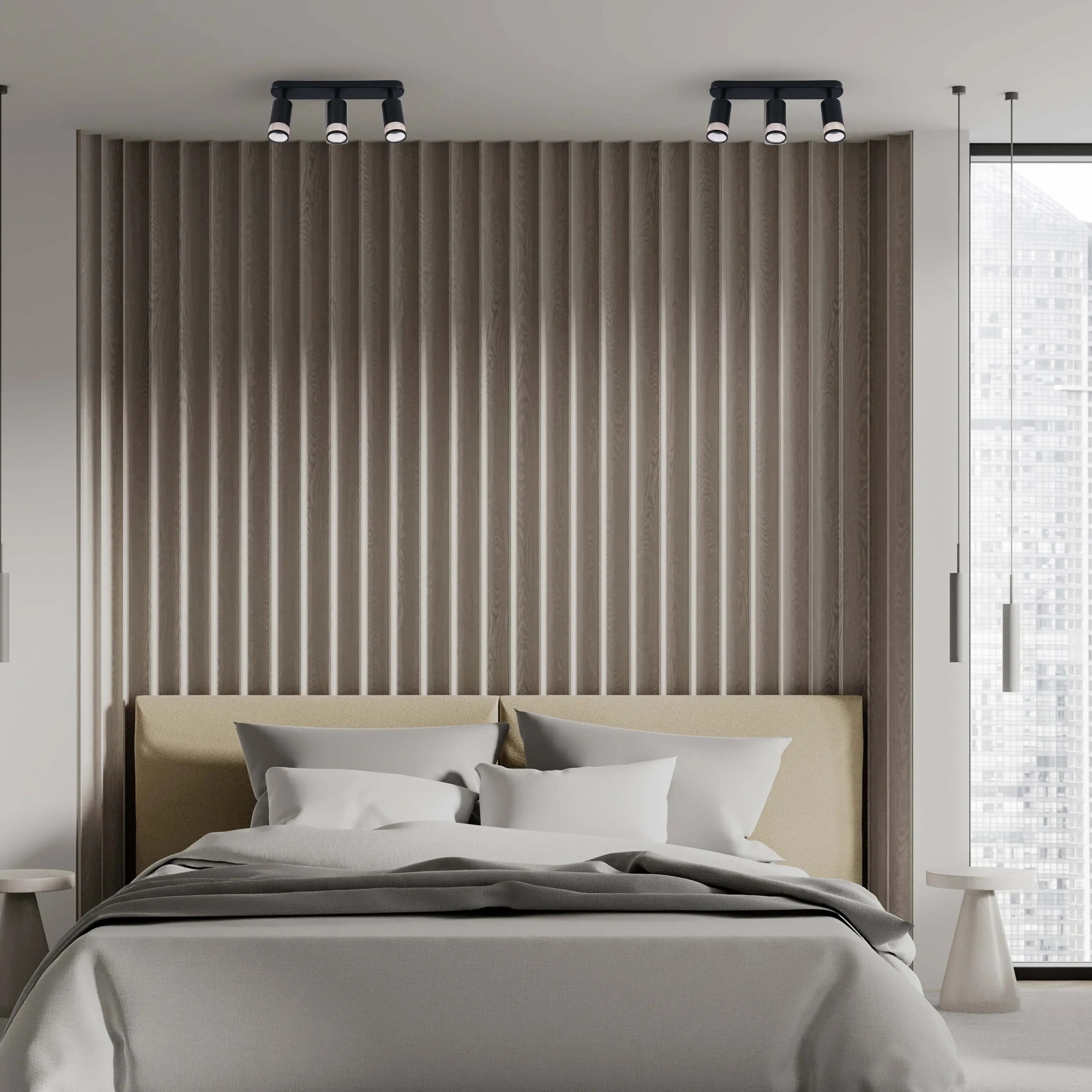 Bedroom with two sets of spotlights on the ceiling, illuminating the textured wooden wall and headboard.