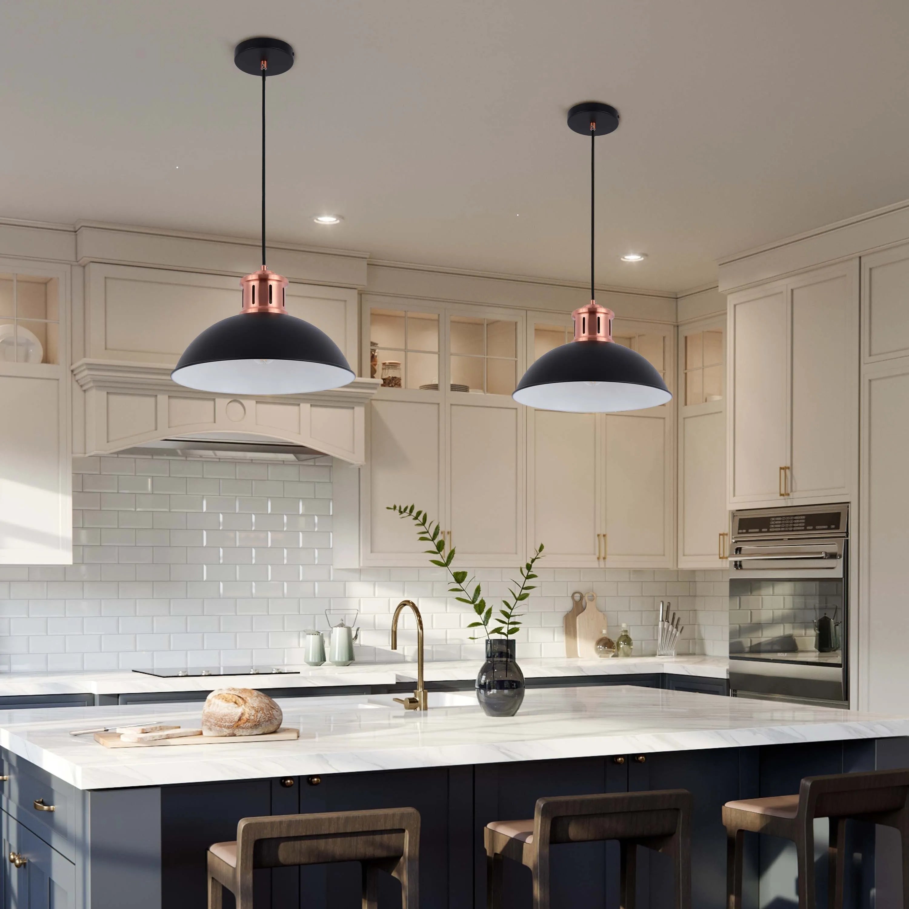 Two black and copper pendant lights hang over a kitchen island, providing stylish and functional illumination.