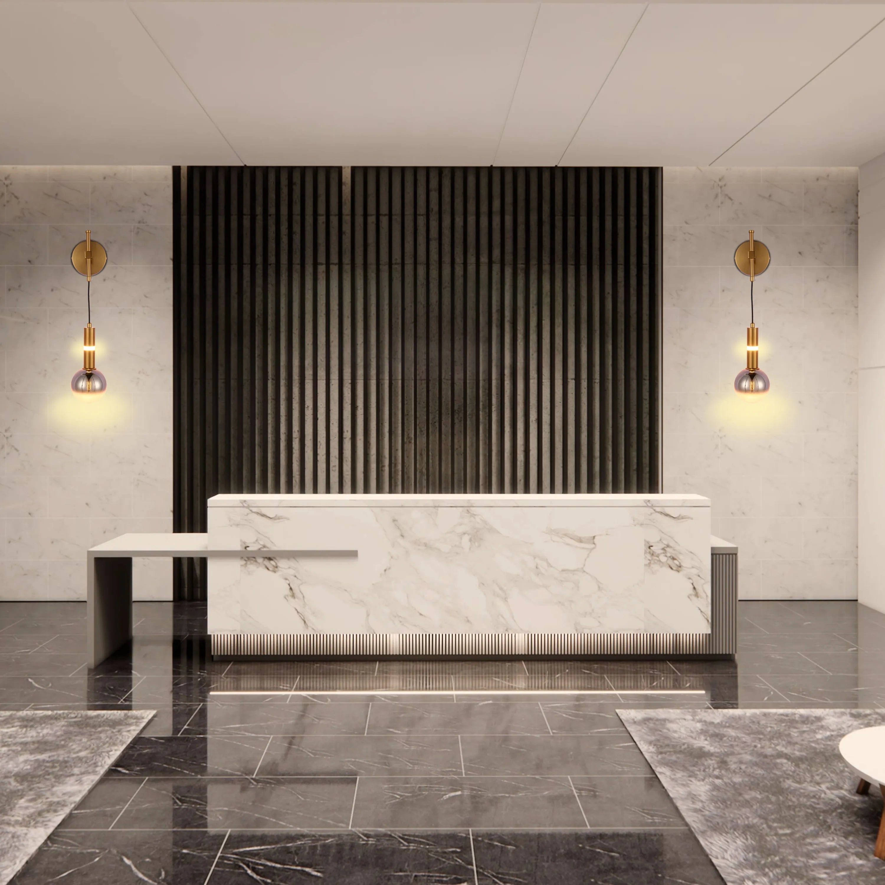 Statement lighting fixtures with gold accents flank a modern reception desk, adding a warm glow to the marble and dark wood backdrop.