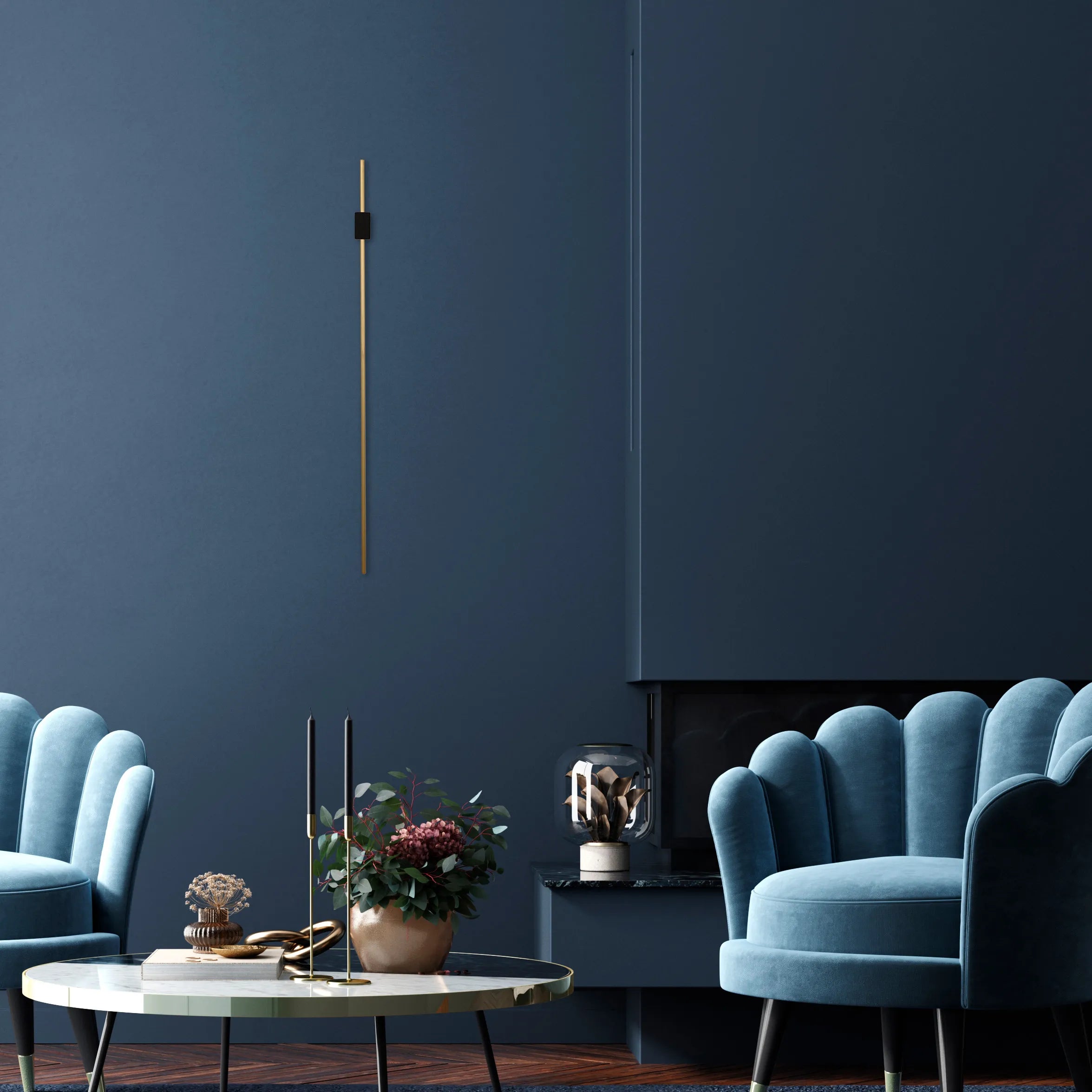 A long gold coloured wall light fixture adorns a dark blue wall in a room setting, adding a sophisticated and modern touch to the space.