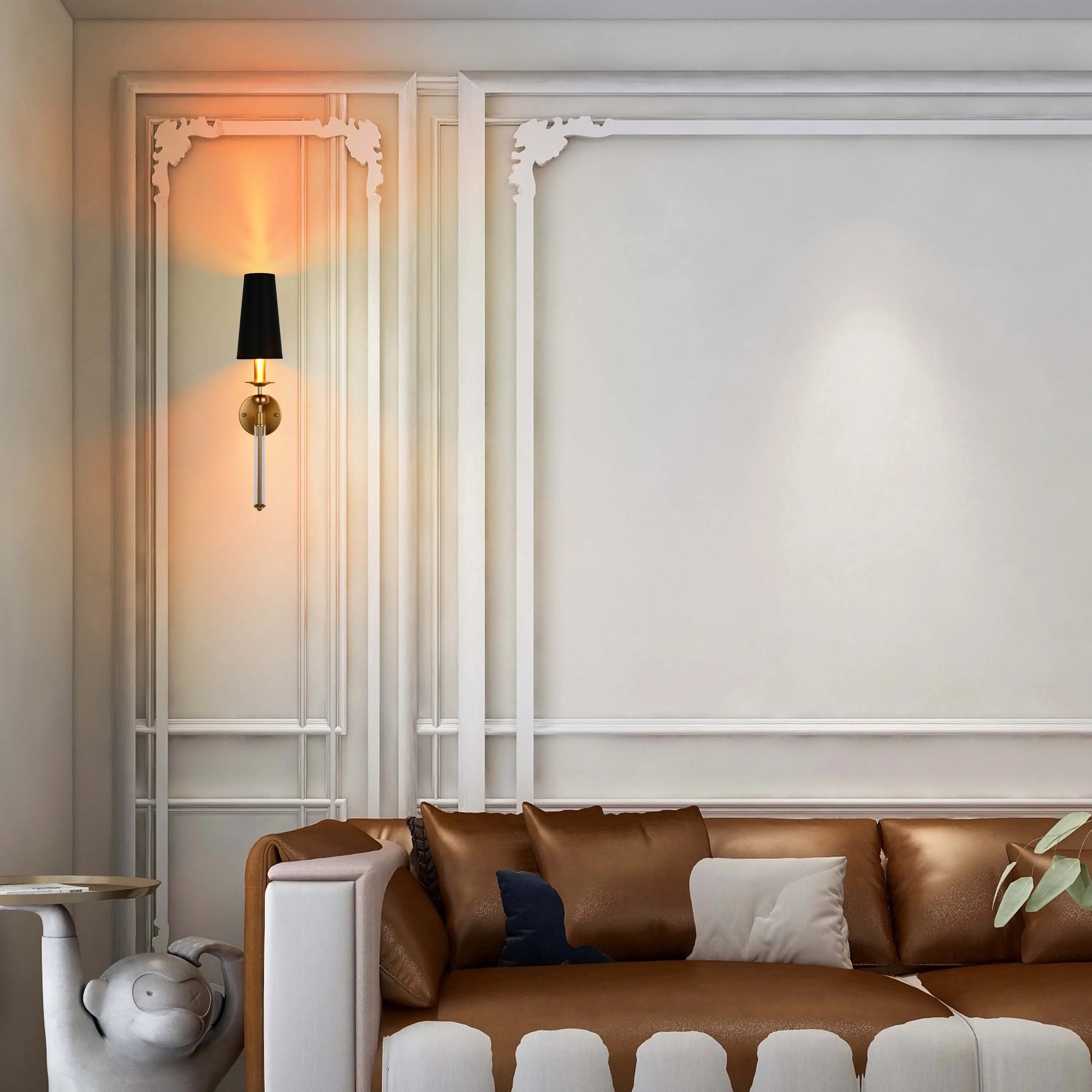 Elegant wall lighting with a black lampshade, gold mount, and clear glass rod emits a warm glow, complementing the classic decor.