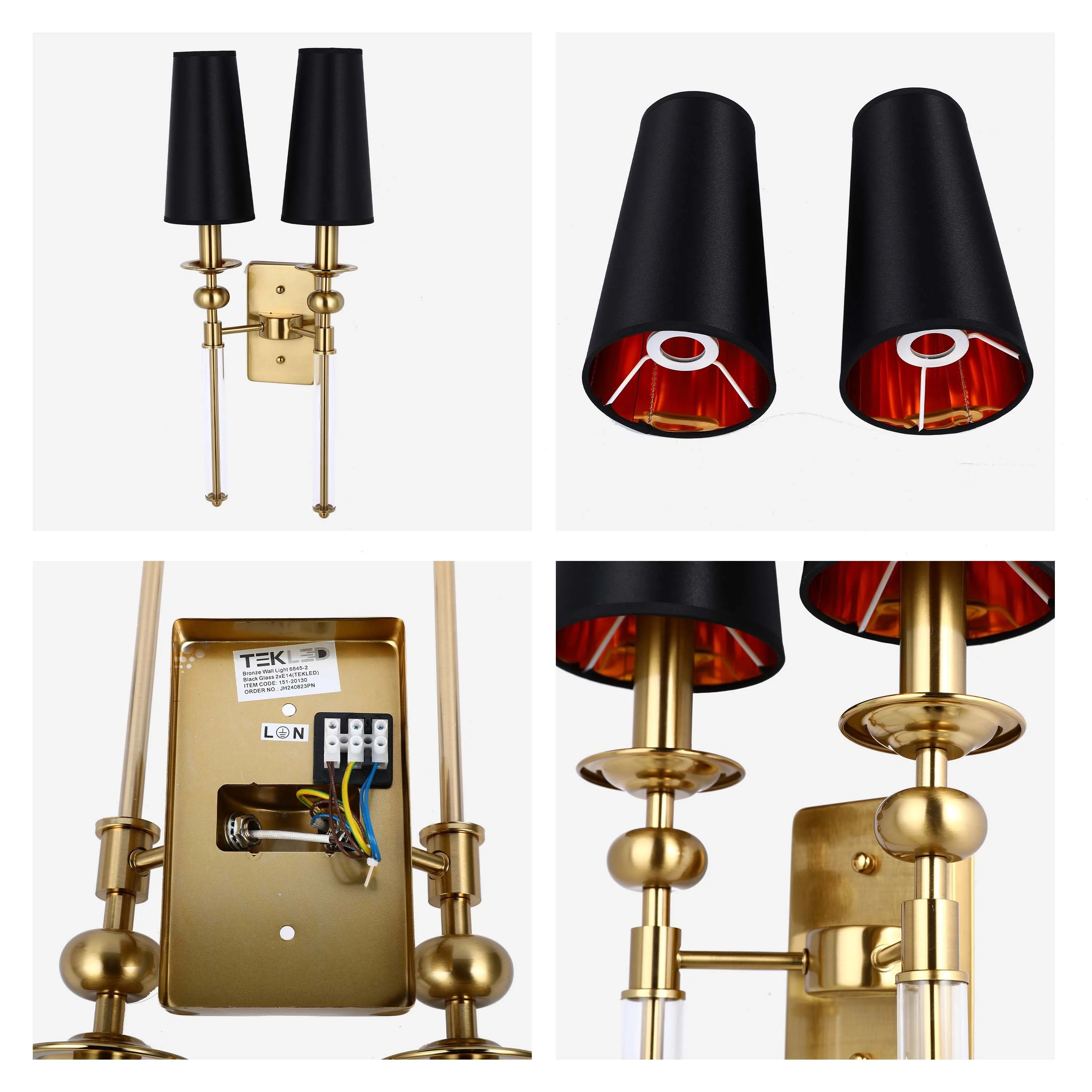 Gold wall light fixture featuring two black lamp shades with red interiors and decorative clear glass accents.