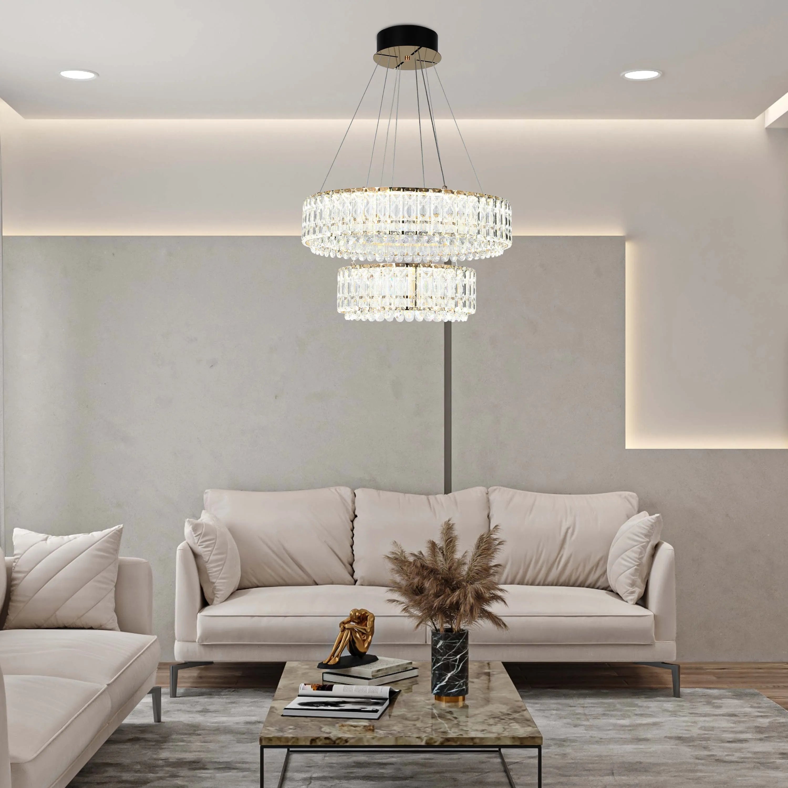 A two-tier crystal chandelier illuminates a living space, complemented by recessed ceiling lights and ambient wall lighting.