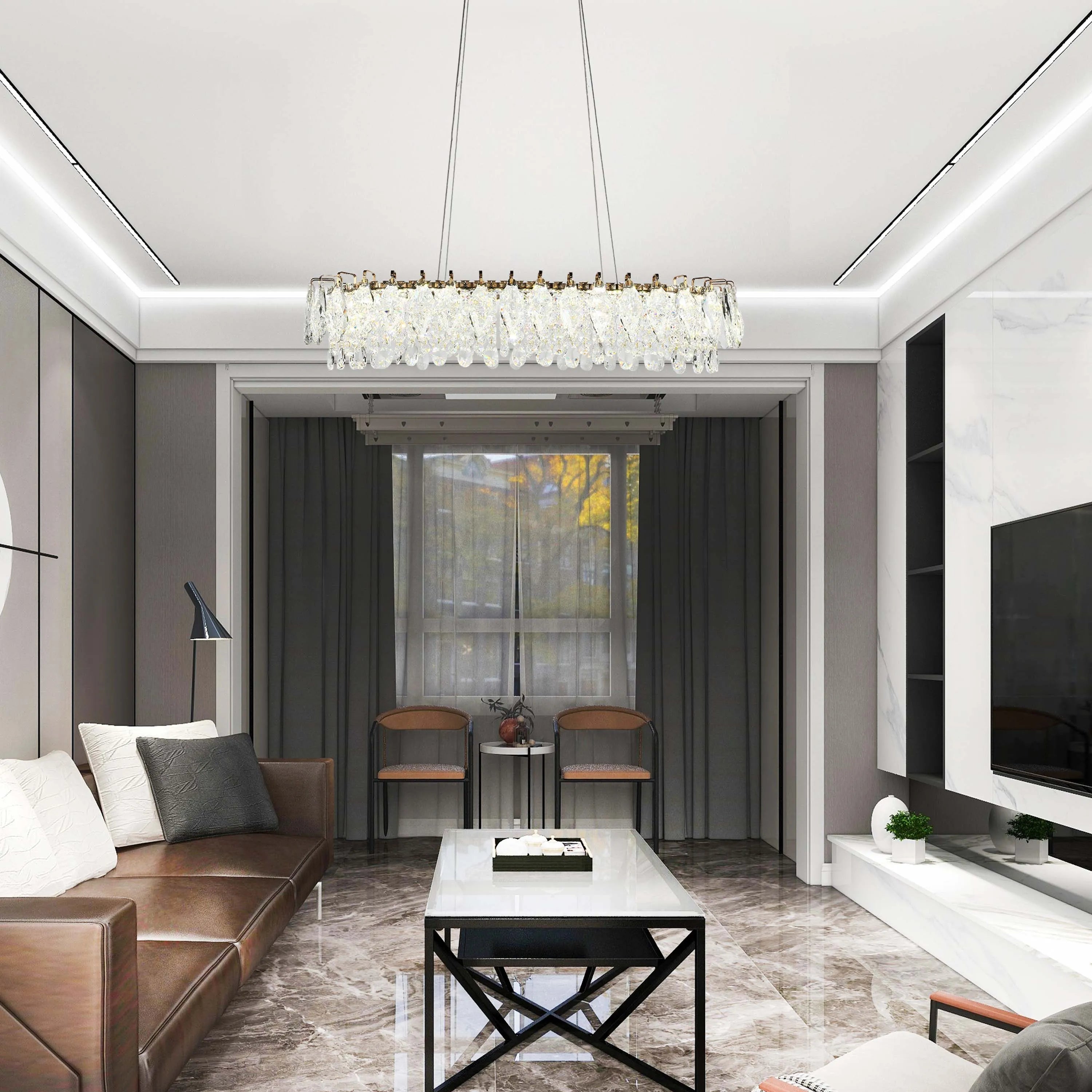 Crystal chandelier lighting above a living room. Modern recessed ceiling lights give added illumination.
