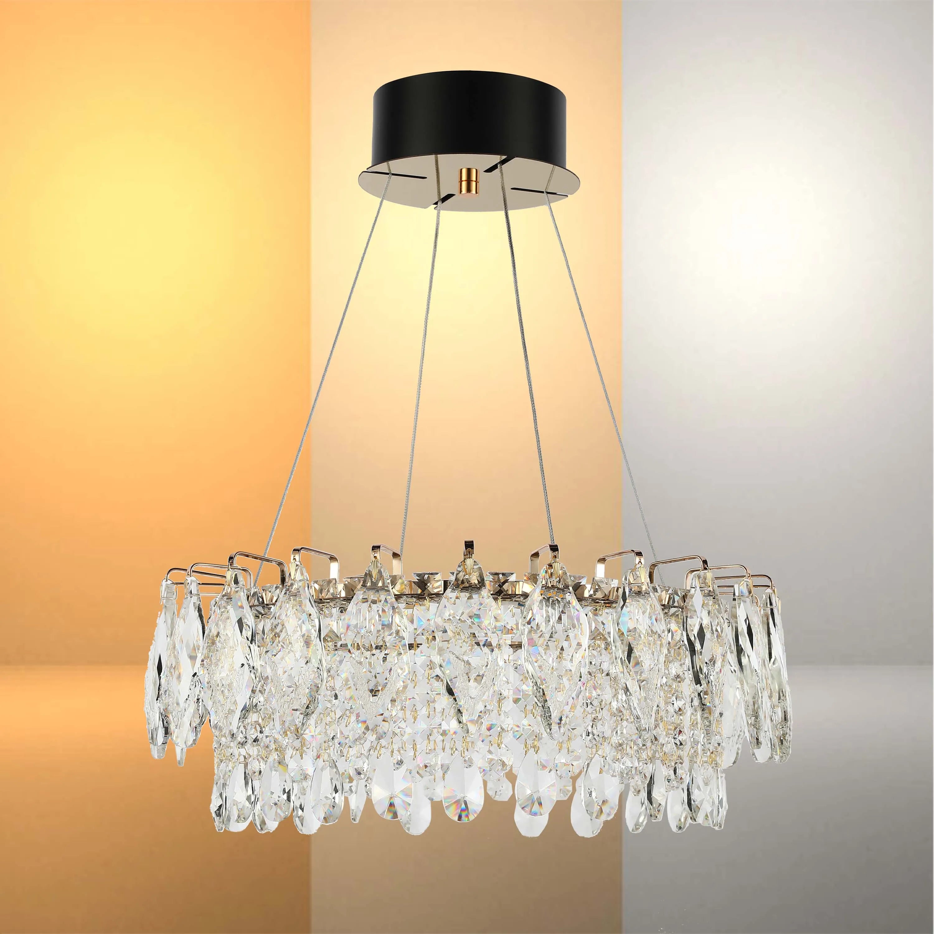 Contemporary crystal chandelier, black canopy, suspended by metal wires, displayed in a warm and cool light setting.