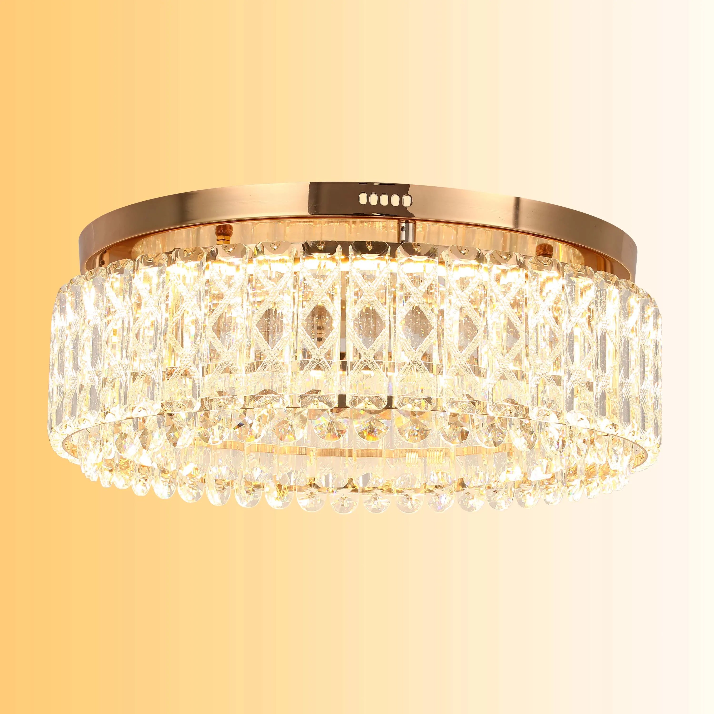 A circular crystal ceiling light with gold trim sparkles against a warm gradient background, creating a luxurious effect.
