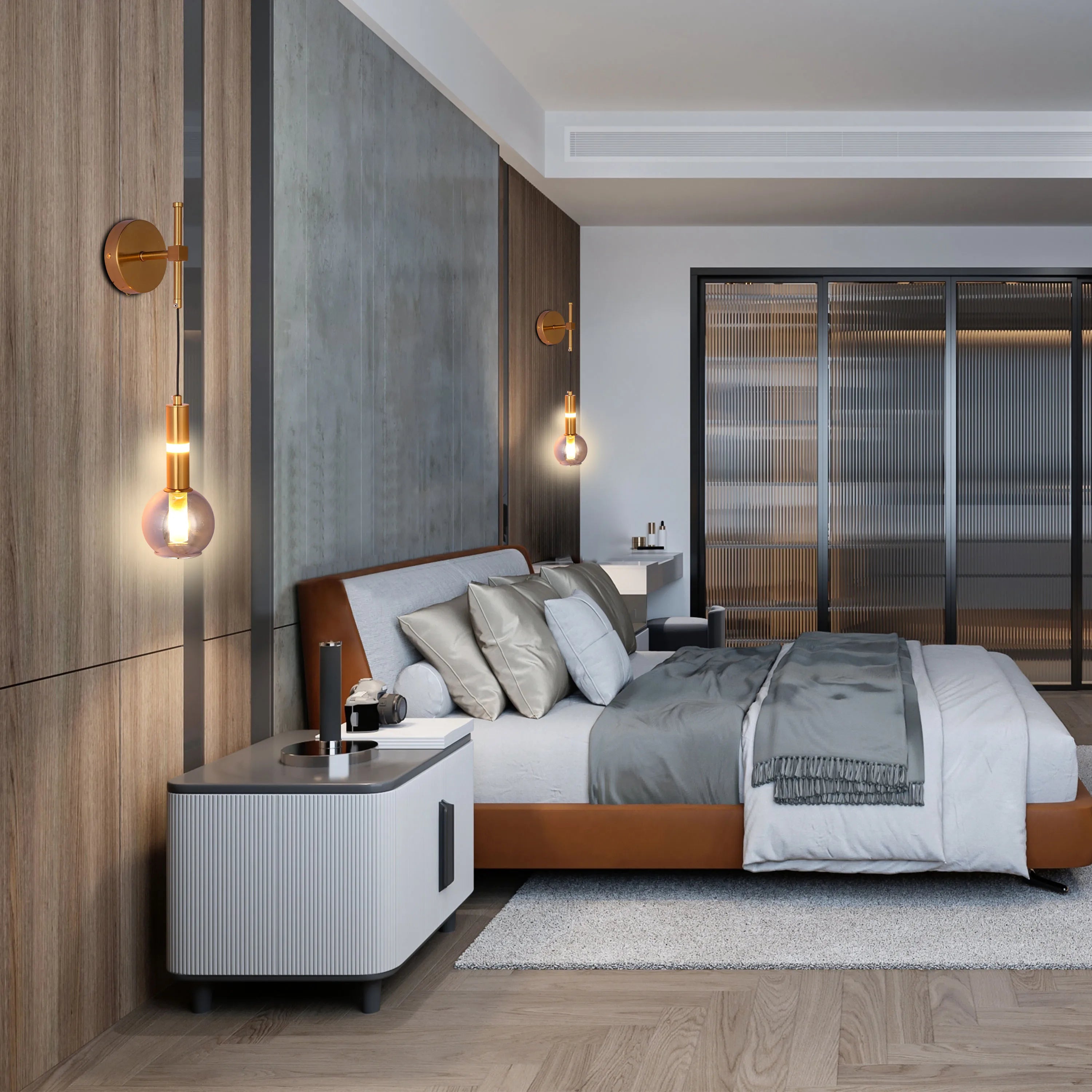 Bedroom with modern wall lamps. Features a brass finish & a glass globe creating a warm, inviting ambience.