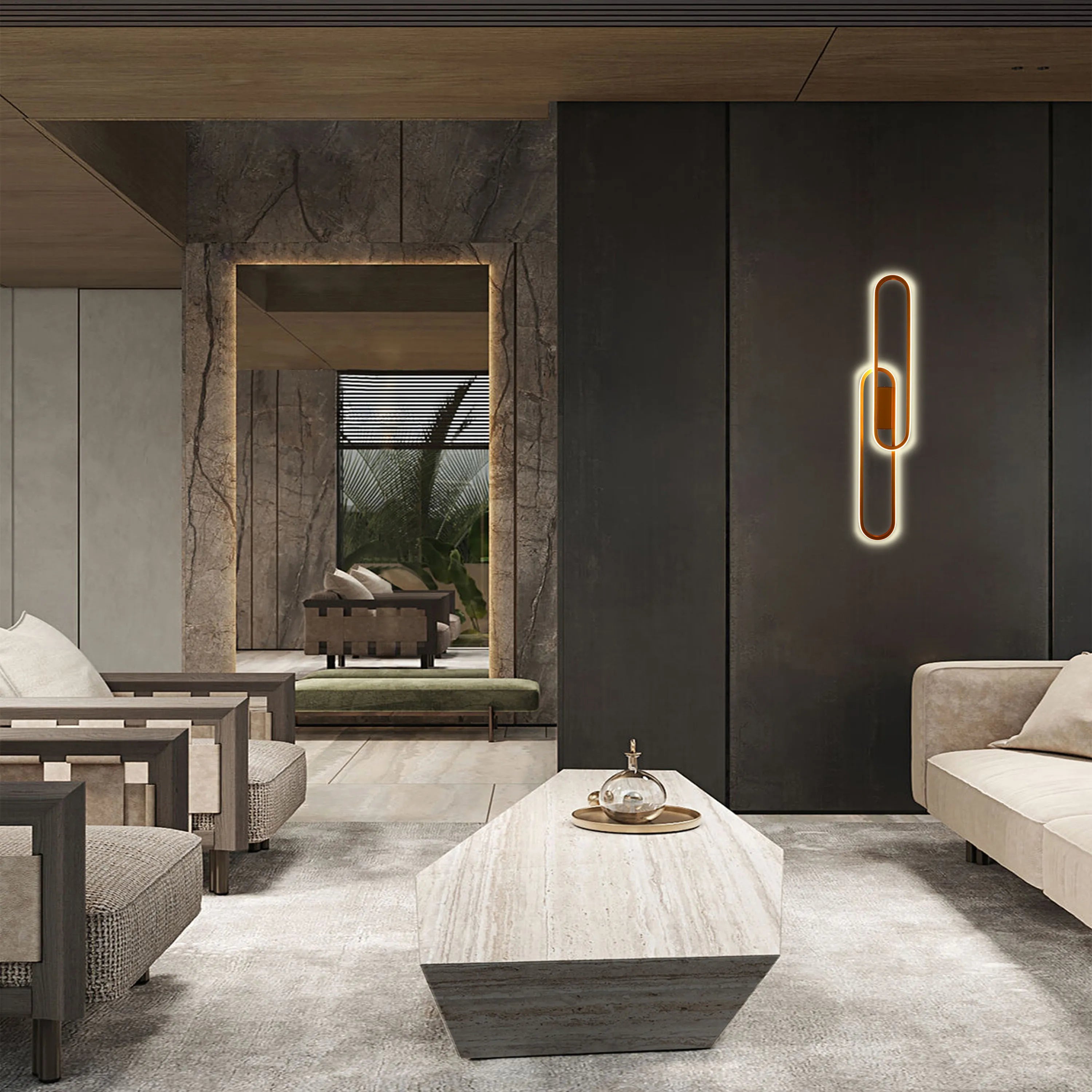 A statement wall light, with a unique shape and warm glow, adds an elegant touch to this modern living space.