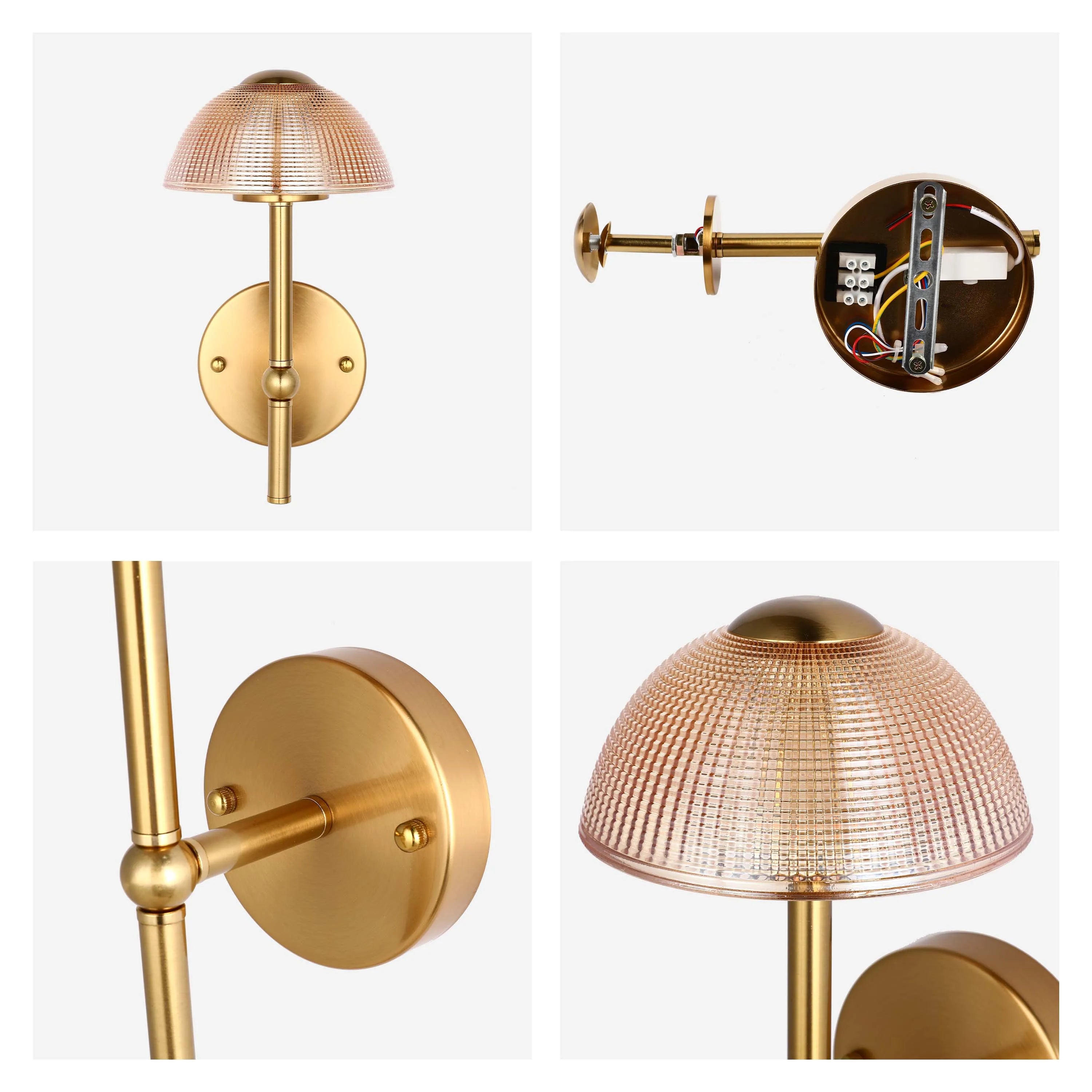 A gold coloured wall light, with a textured amber glass shade in a dome shape, attached by a gold metal rod.