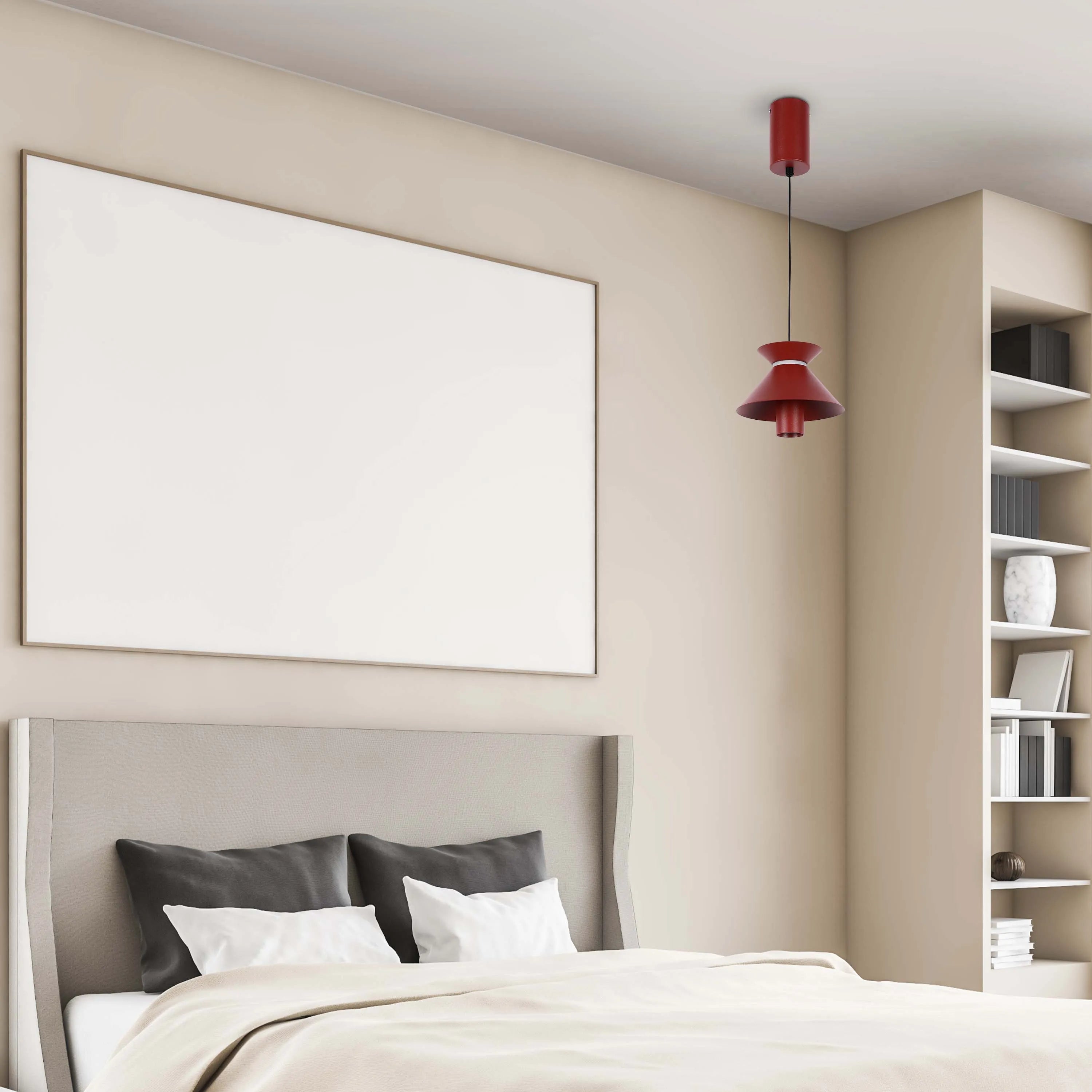 A red pendant light fixture hangs above a bed, providing a modern, stylish accent in a neutral-toned bedroom.