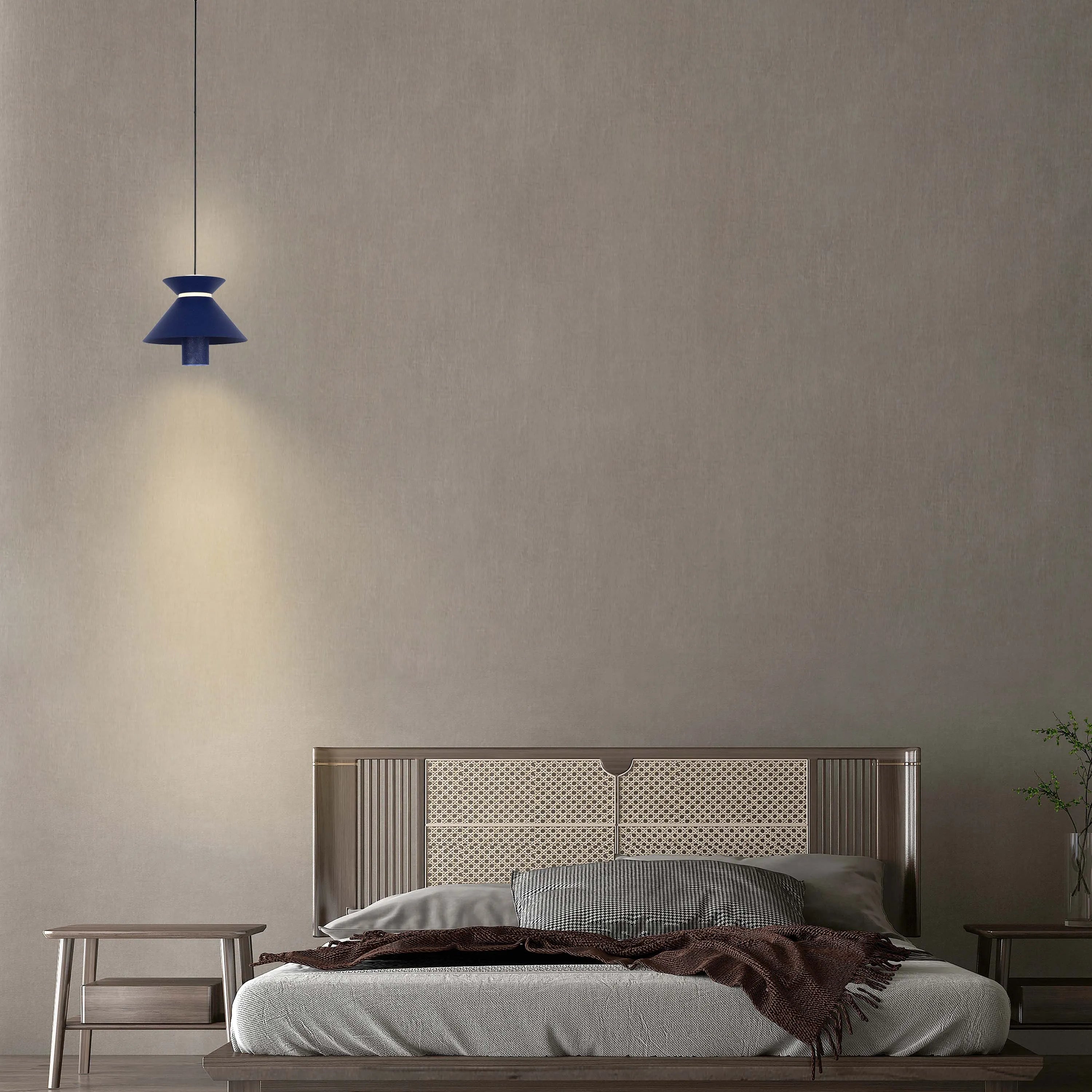A statement pendant light casts a warm glow, illuminating this modern bedroom setting. Its contemporary design complements the room's neutral tones.