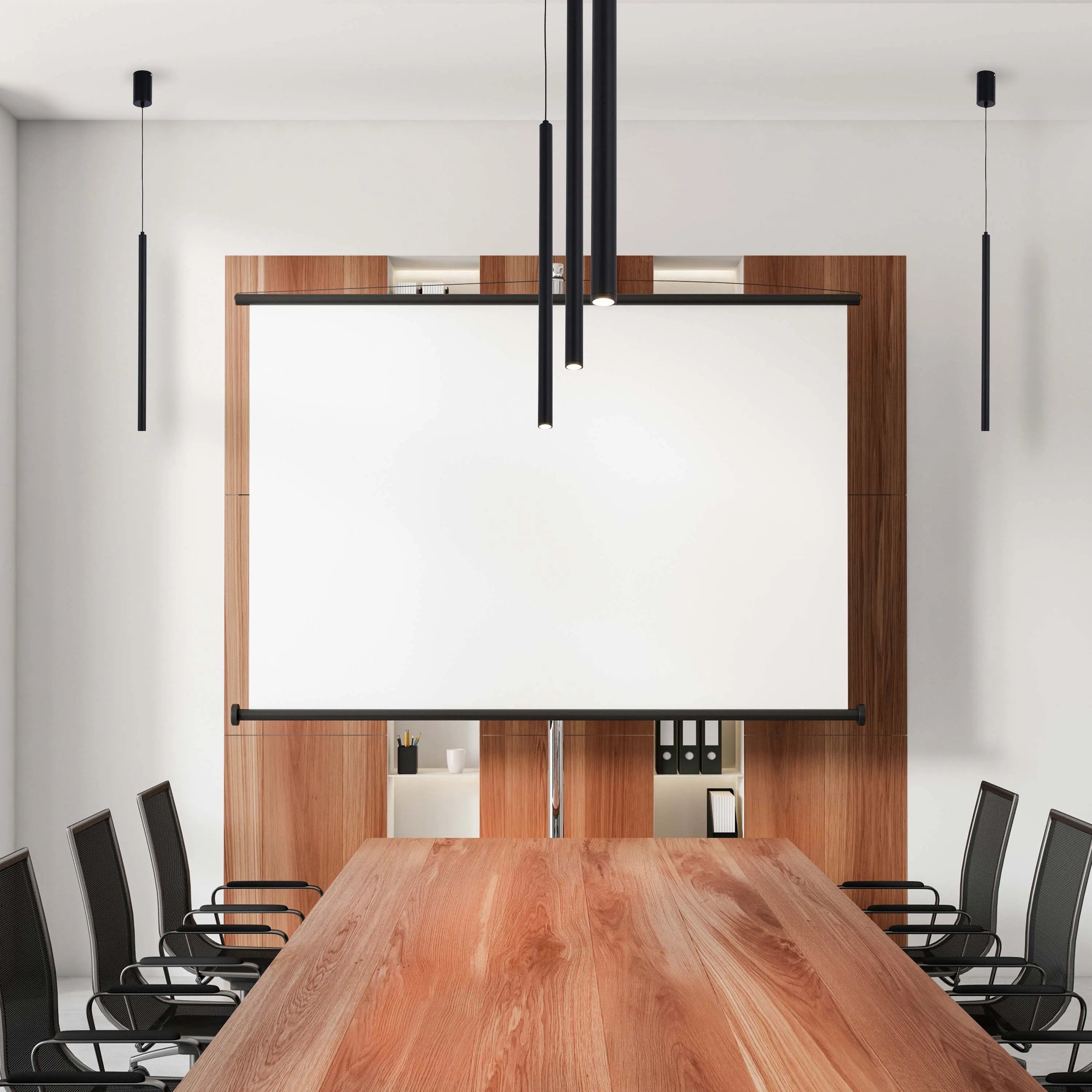 Modern conference room lighting with pendant lights. The minimalist design is perfect for a business setting.
