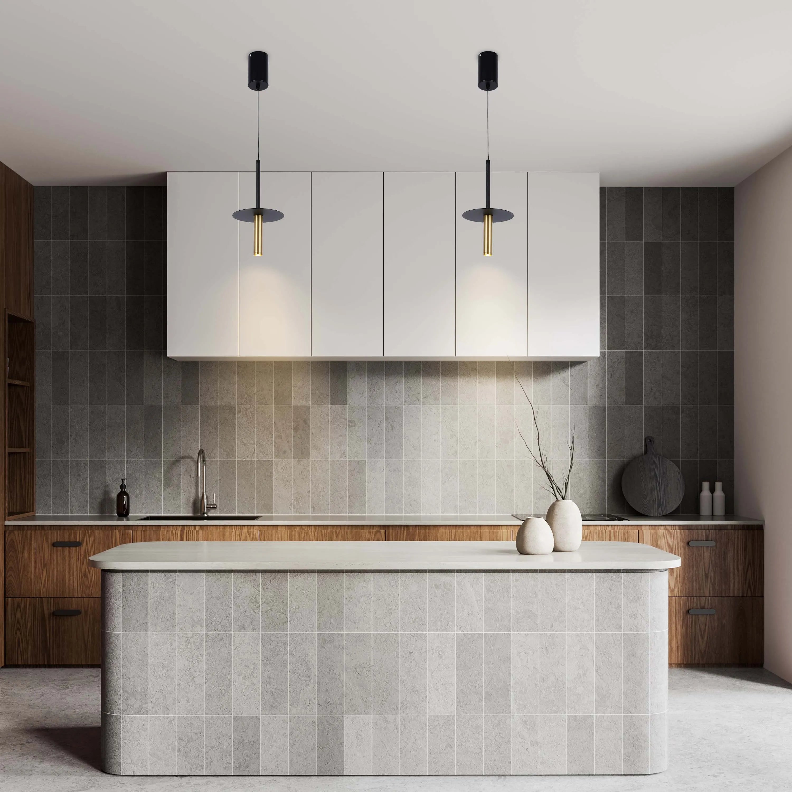 Contemporary kitchen lighting featuring two stylish pendant lights with black and gold finishes, illuminating the kitchen island.
