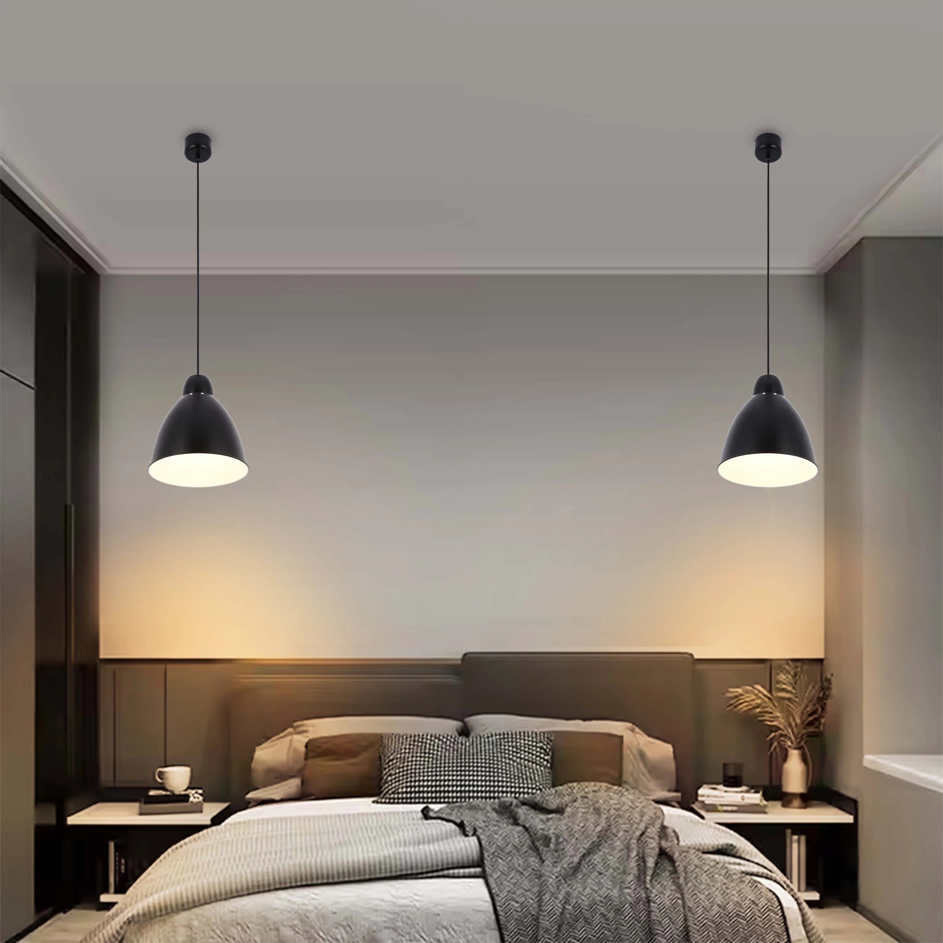 Modern bedroom featuring two stylish black pendant lights that provide warm ambient illumination.