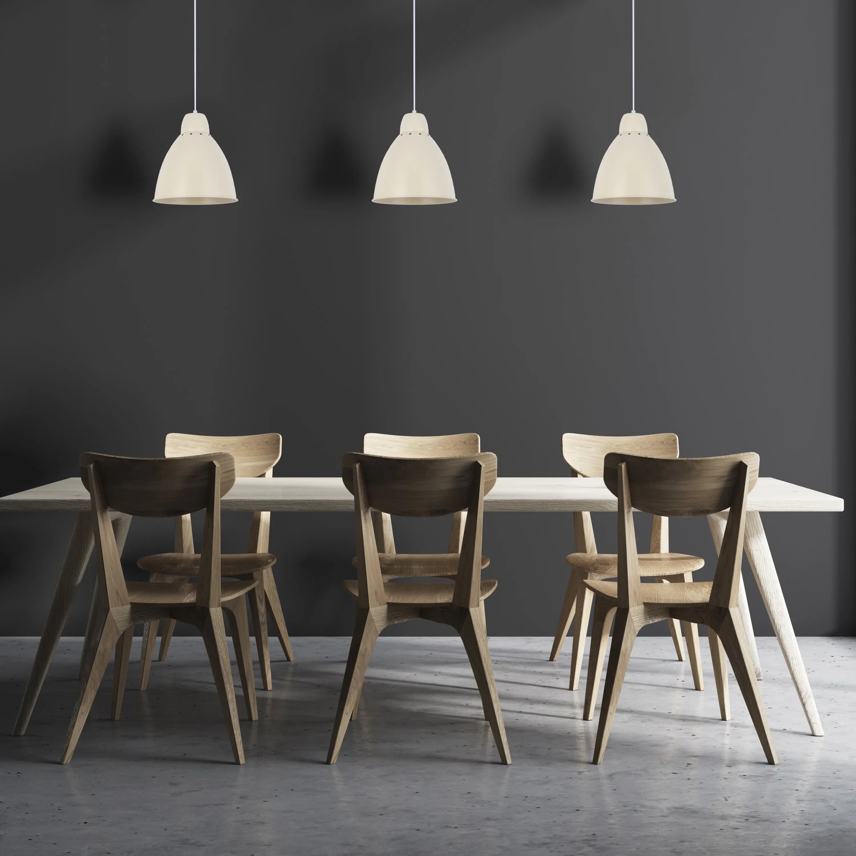 A trio of off-white pendant lights hang over a dining table, illuminating the dark grey wall and wooden furniture in this modern dining space.