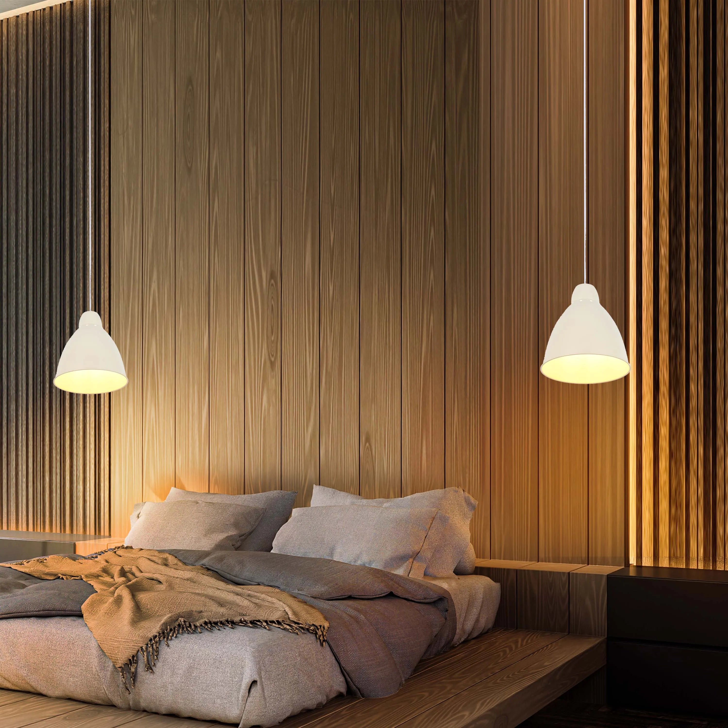 Two hanging pendant lights illuminate a neutral bedroom featuring natural wood paneling and platform bed, creating a warm ambience.