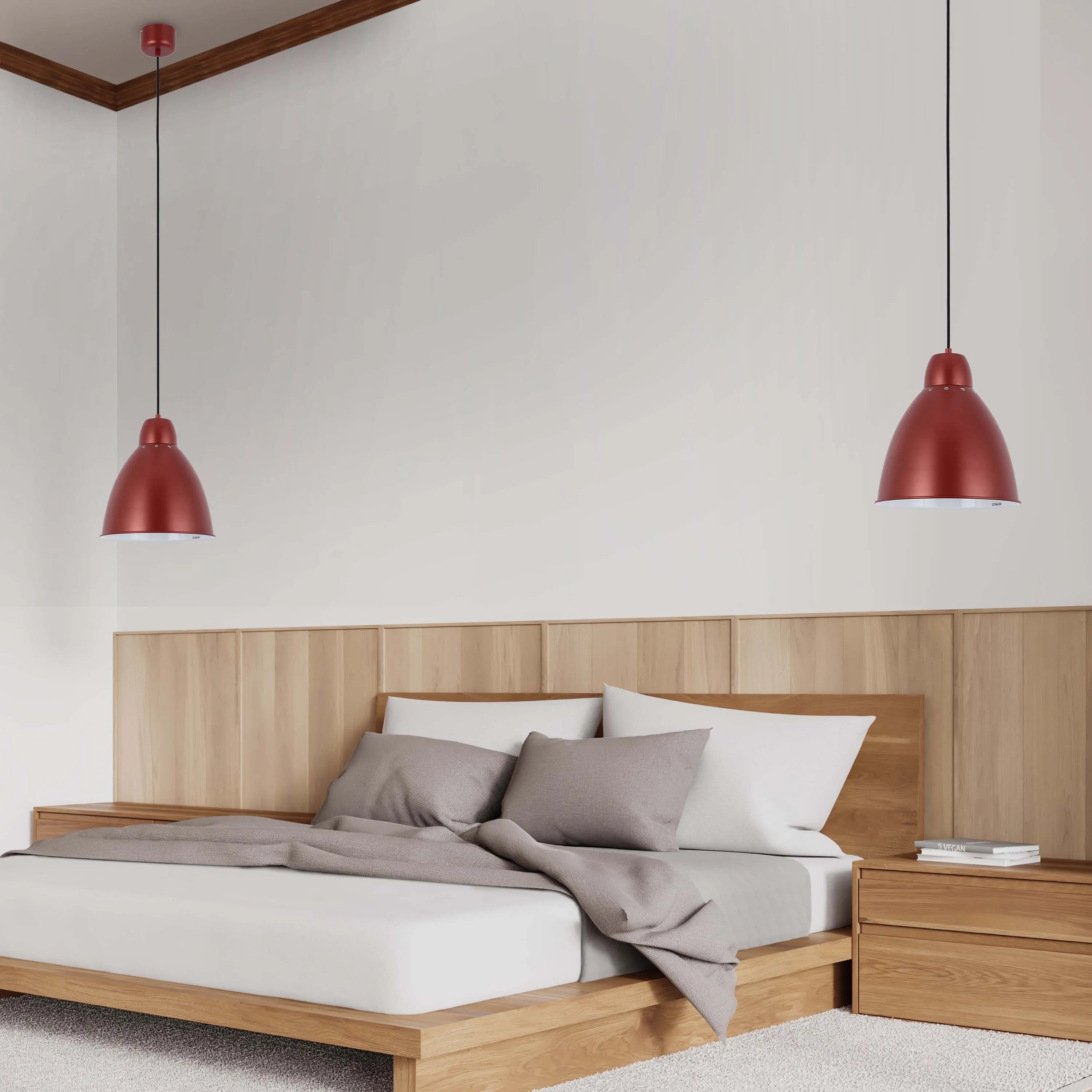 Bedroom with red pendant lights hanging on either side of a wooden bed with a headboard. Neutral tones and minimalist design throughout.