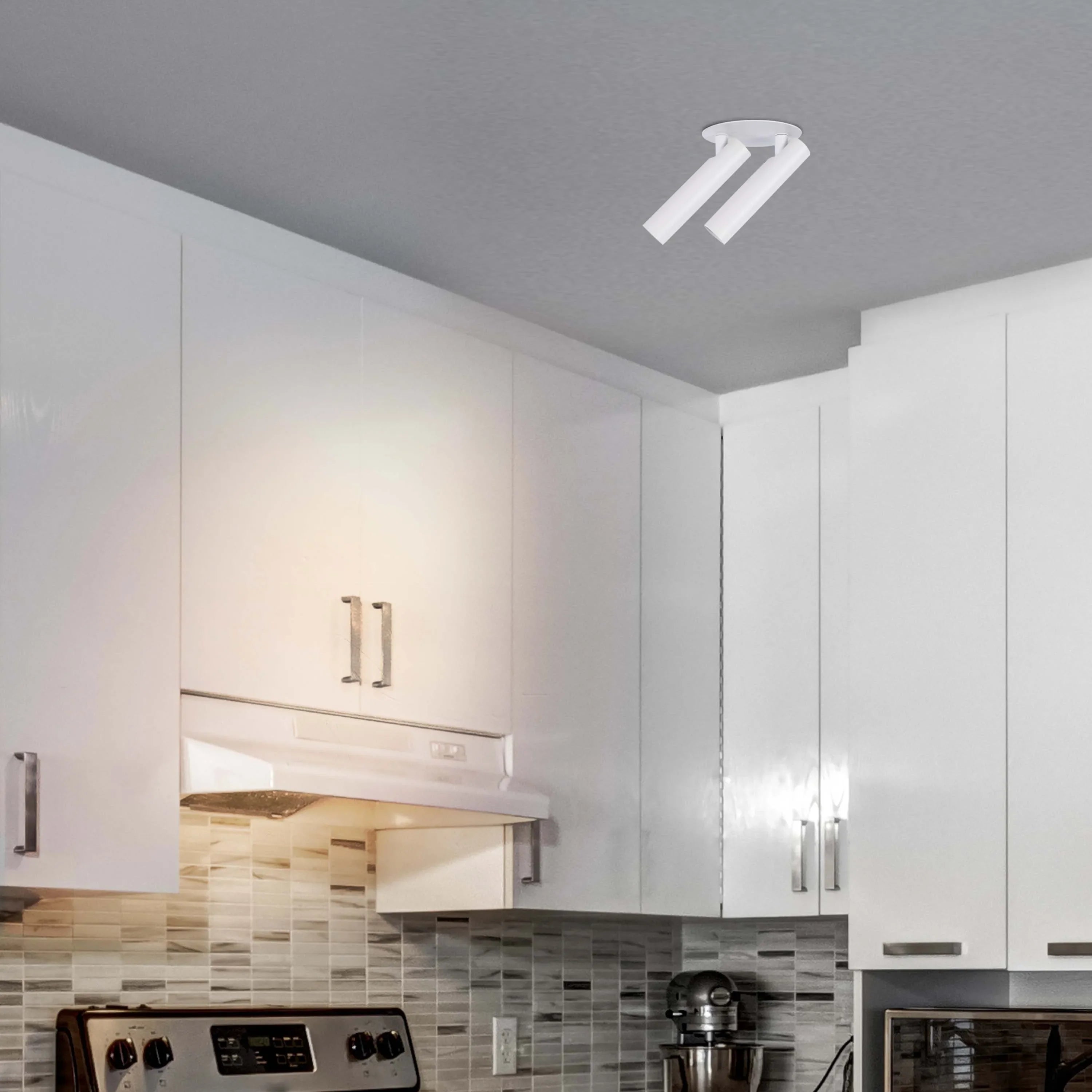 A dual spotlight fitting provides task lighting in this modern kitchen. The adjustable heads offer flexible illumination.
