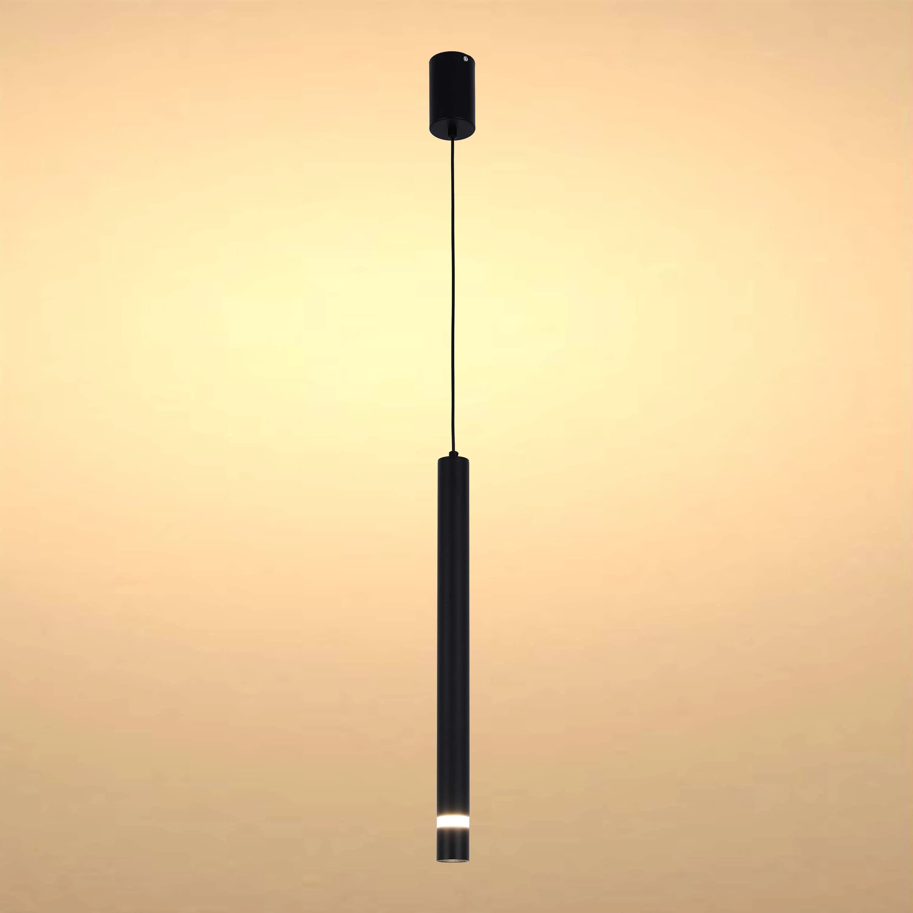 A minimalist, black pendant light provides focussed illumination in a contemporary setting.