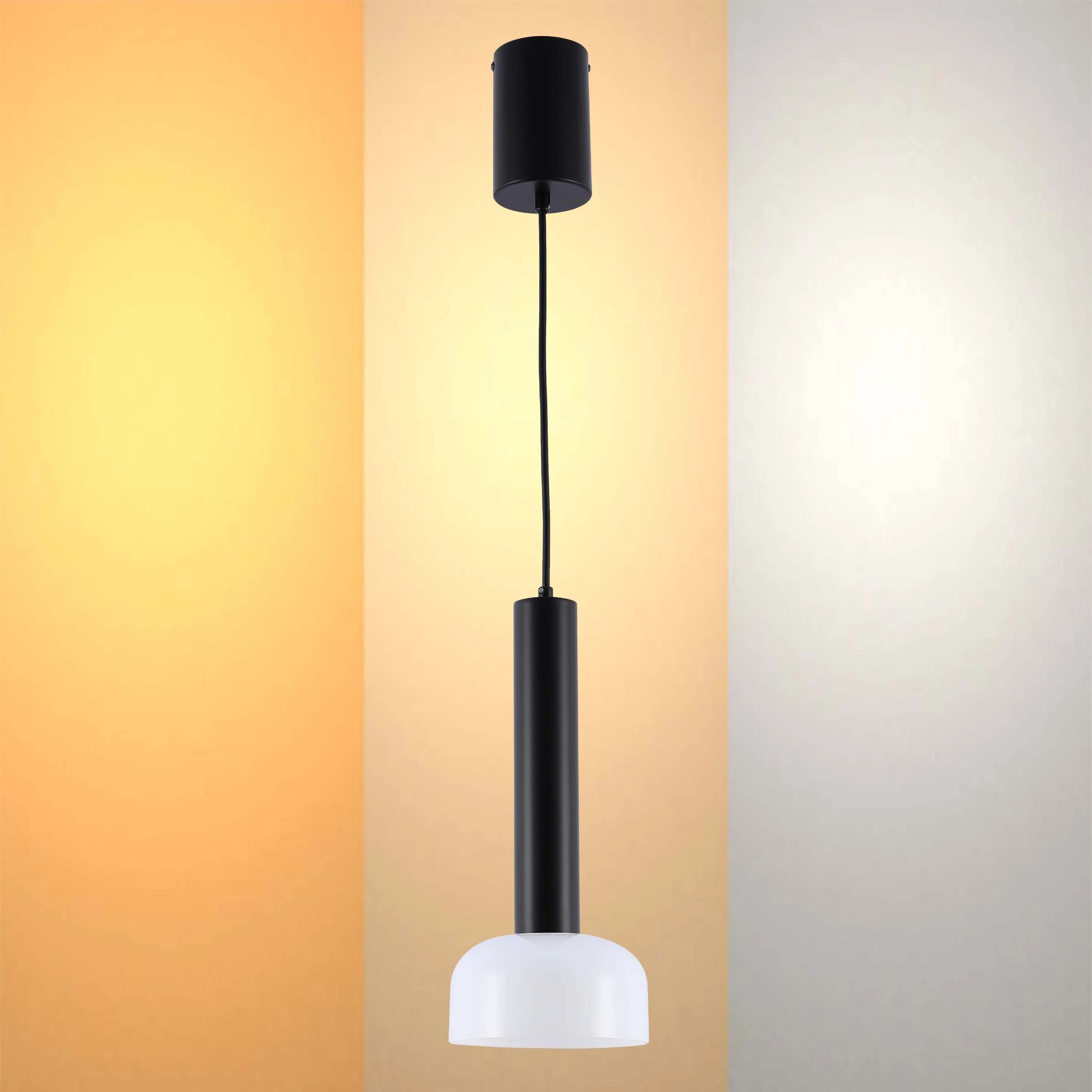 A stylish, modern pendant light. Sleek black cylinder with a white dome shade, hanging from a black cord.
