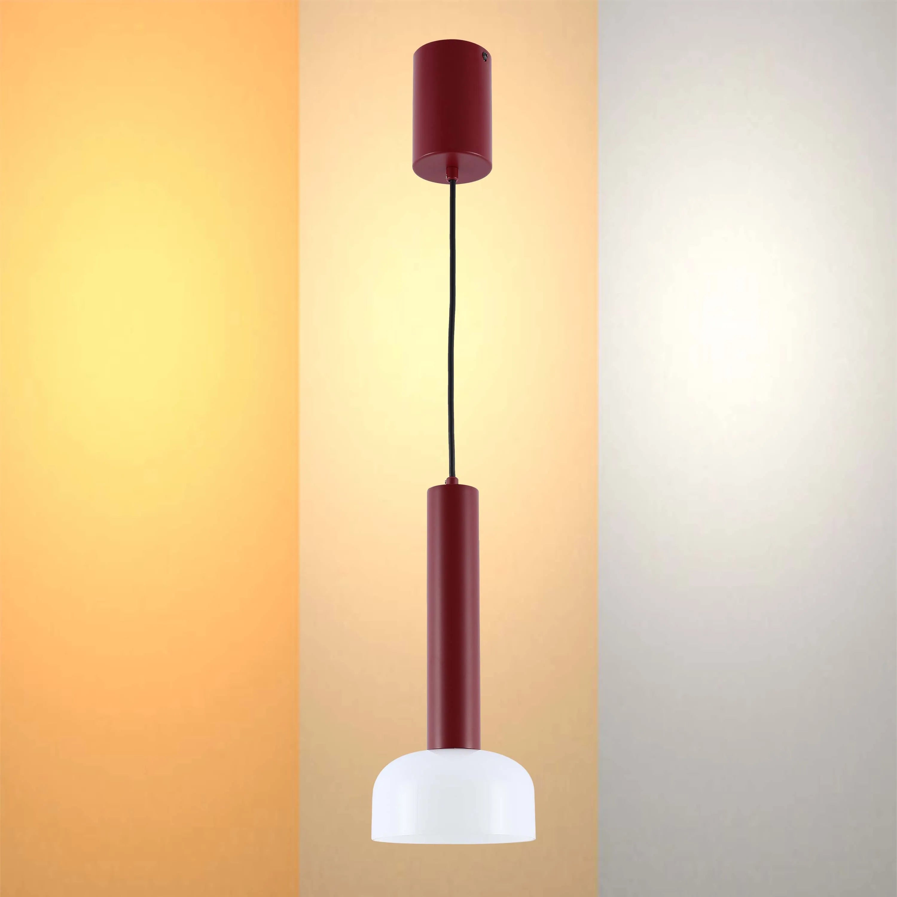 A modern, minimalist pendant light featuring a burgundy shade and white diffuser, suspended by a black cable.