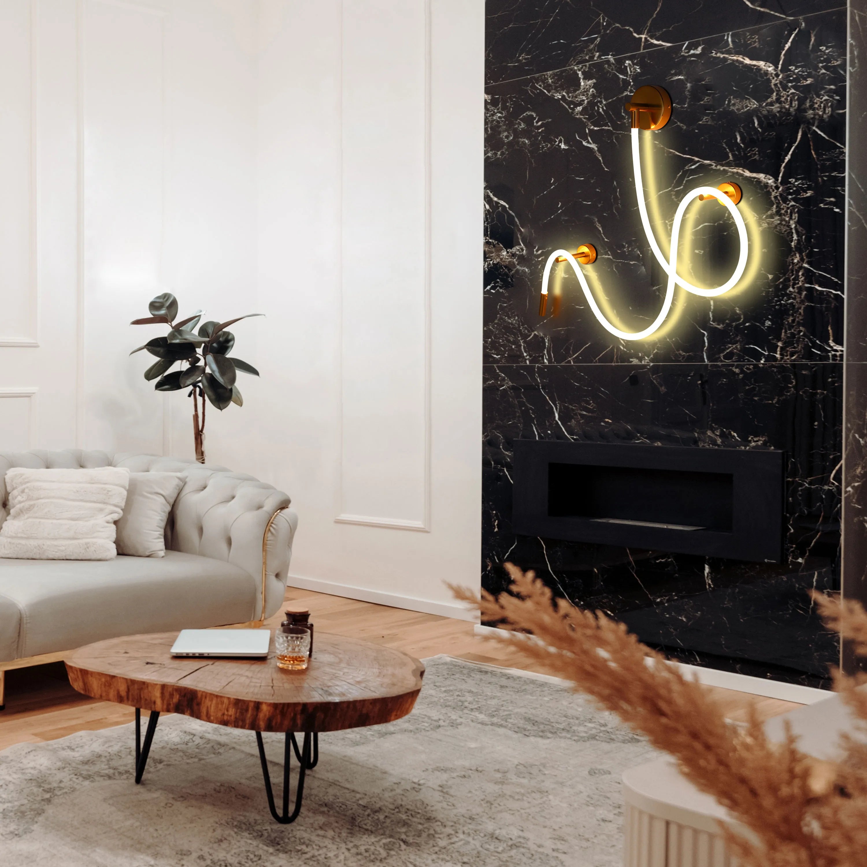 Stylish neon wall light in a sculptural design, mounted on a black marble wall above a modern fireplace.