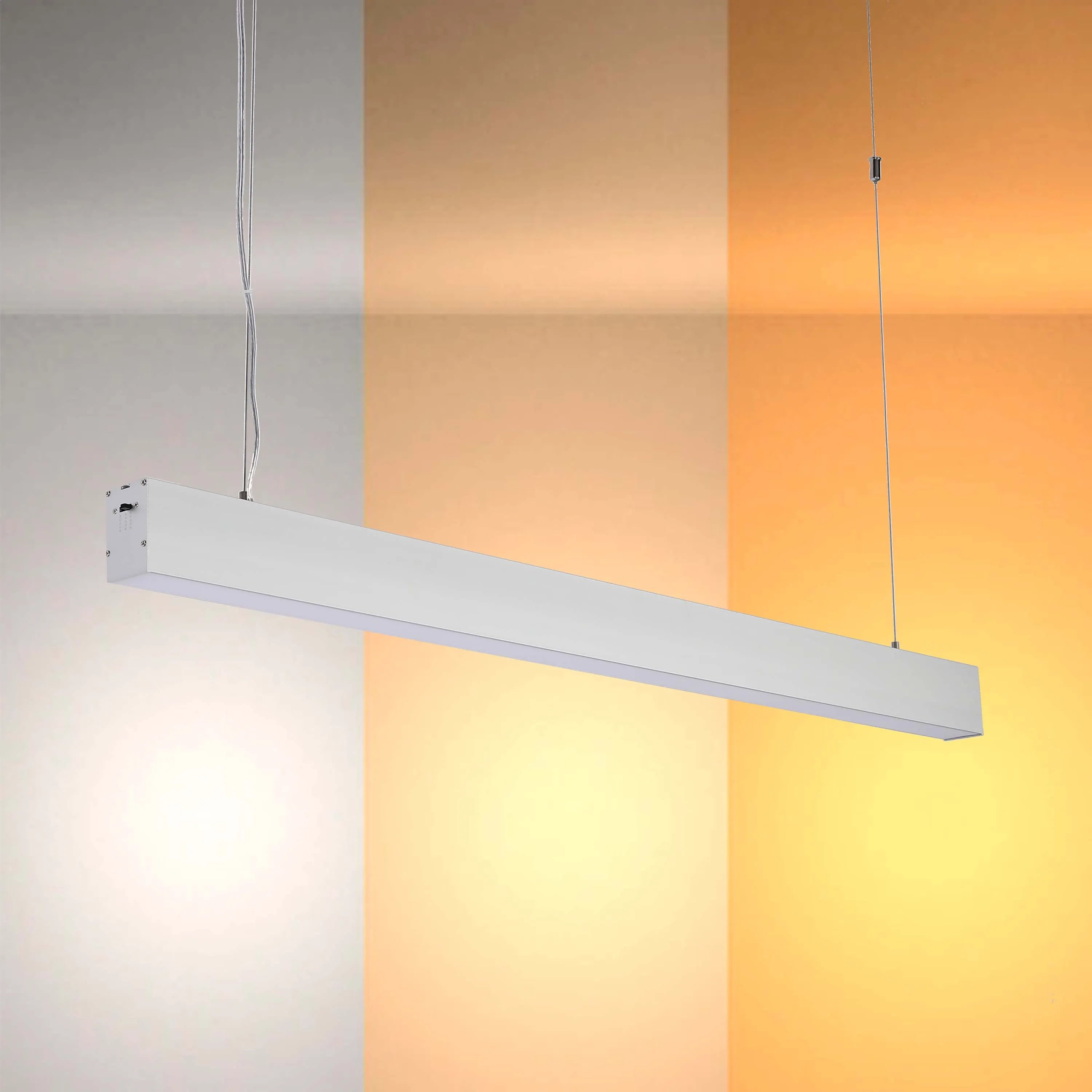 Modern white pendant light emitting cool, warm and amber light, suitable for contemporary interiors.