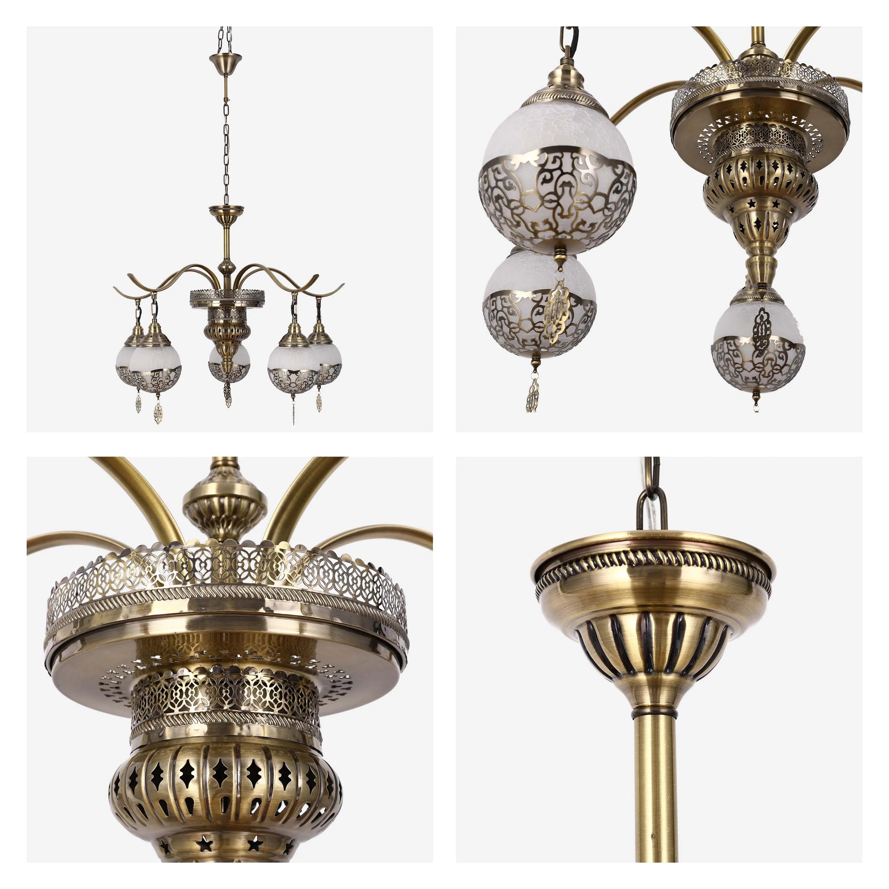 A gold-toned, ornate chandelier with patterned white shades. A statement piece for ambient lighting.